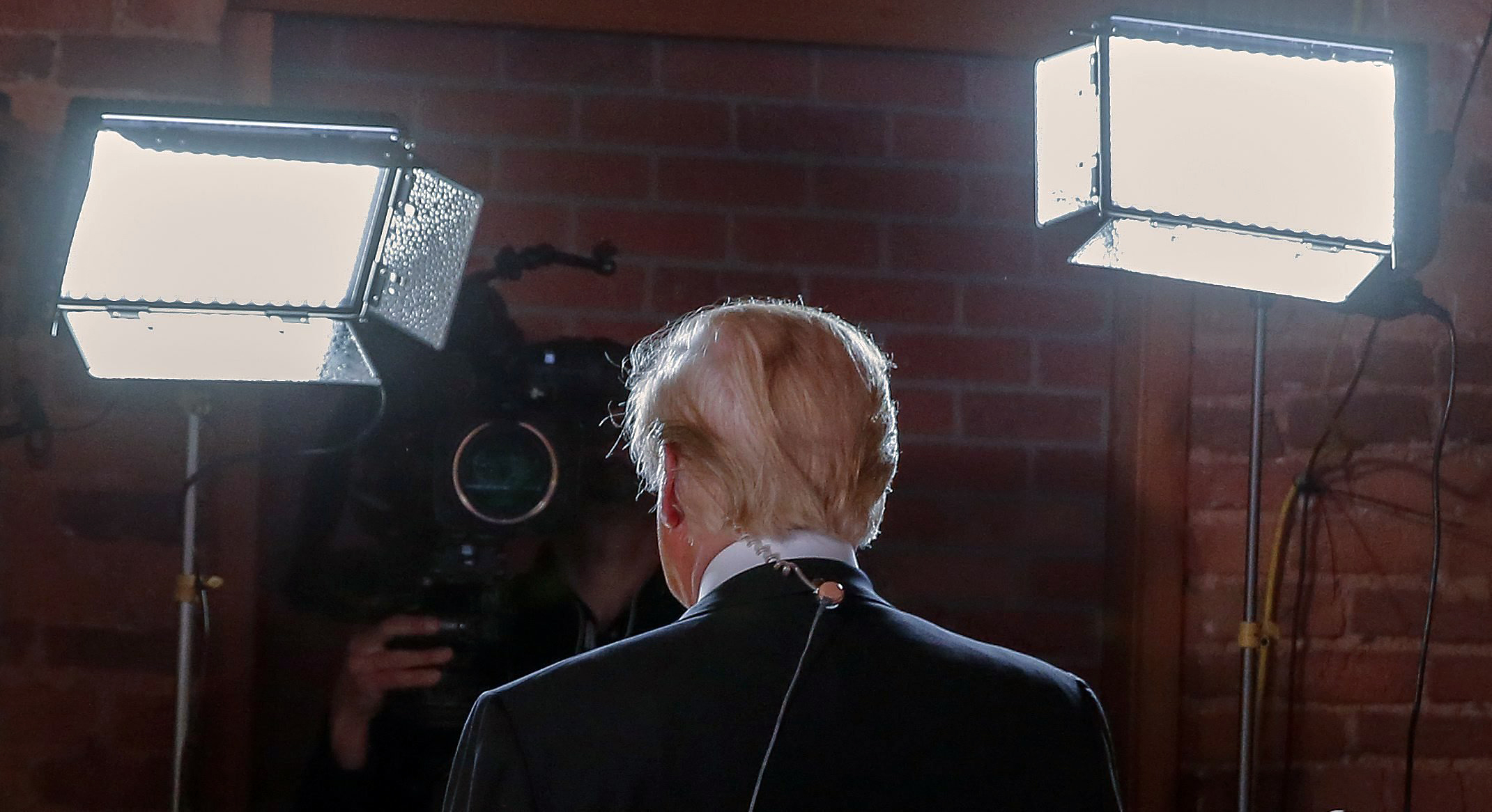 Republican presidential candidate Donald Trump walks through the Spin Room after a Republican presidential debate at the Peace Center in Greenville, S.C. on Feb. 13, 2016.