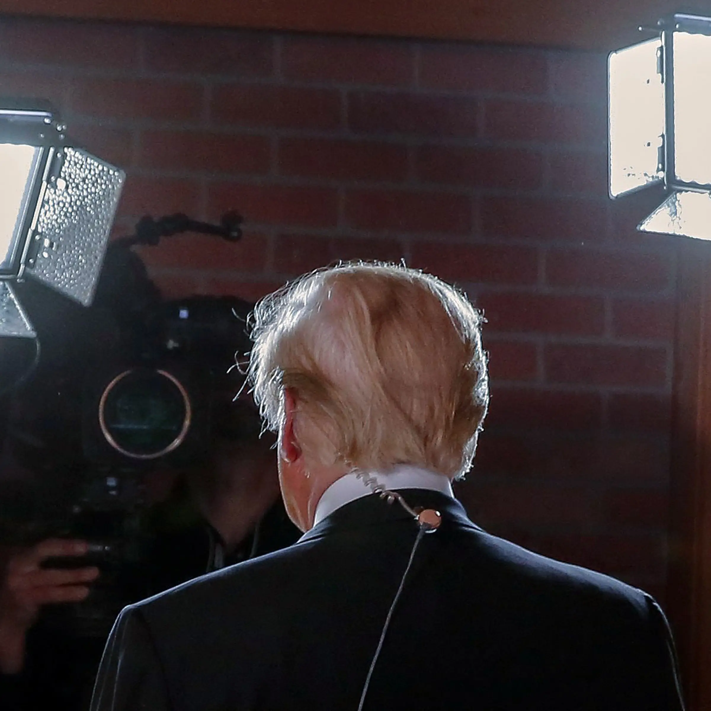 Republican presidential candidate Donald Trump walks through the Spin Room after a Republican presidential debate at the Peace Center in Greenville, S.C. on Feb. 13, 2016.