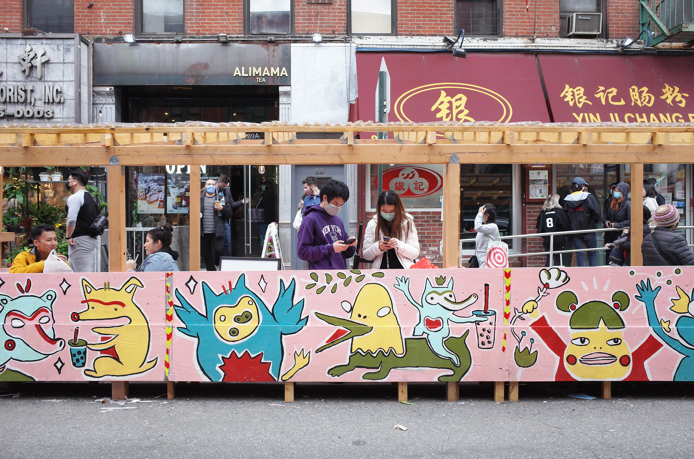 Chanel Miller's illustrative artwork on the corner of Bayard and Mulberry Streets in Chinatown, New York on April 17