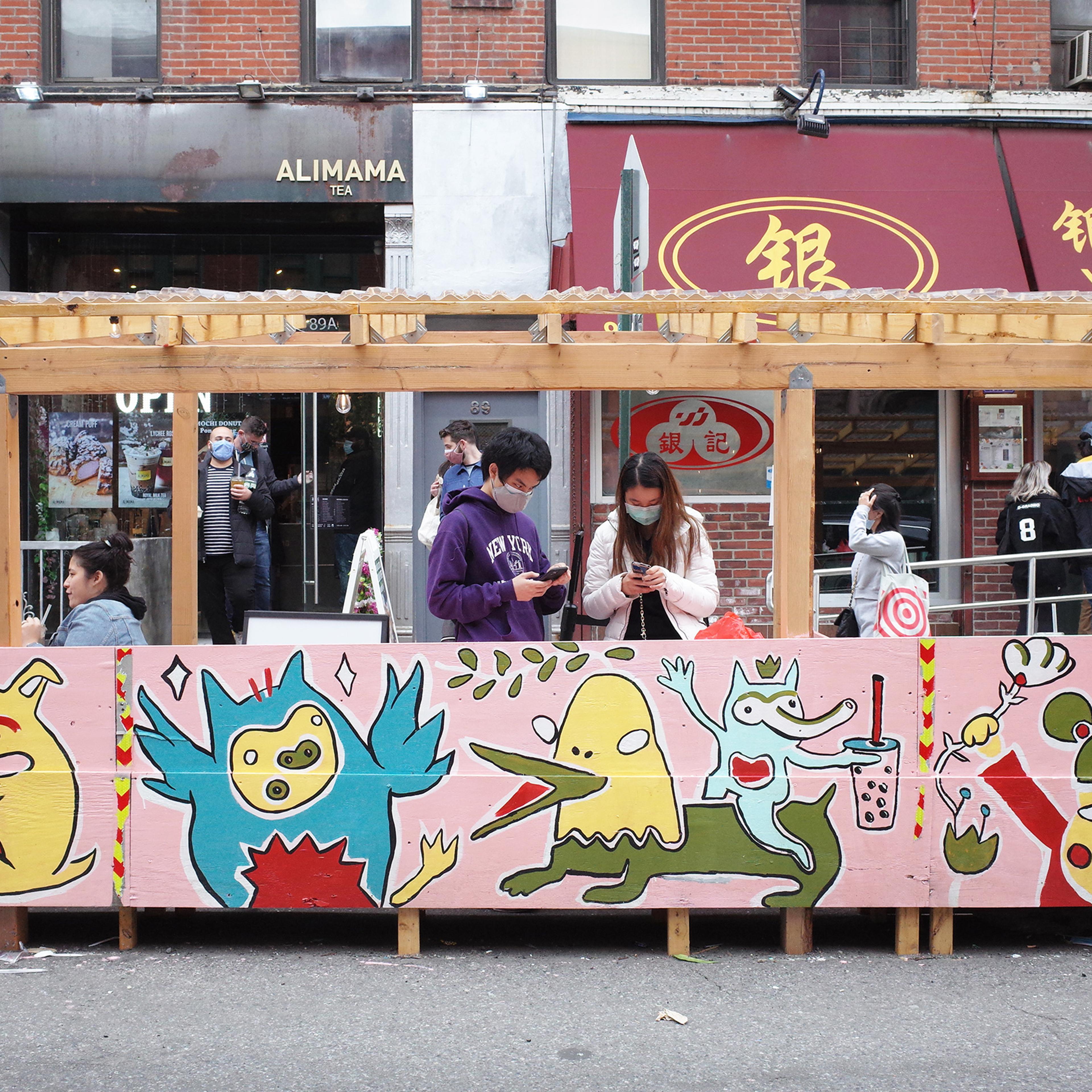 Chanel Miller's illustrative artwork on the corner of Bayard and Mulberry Streets in Chinatown, New York on April 17