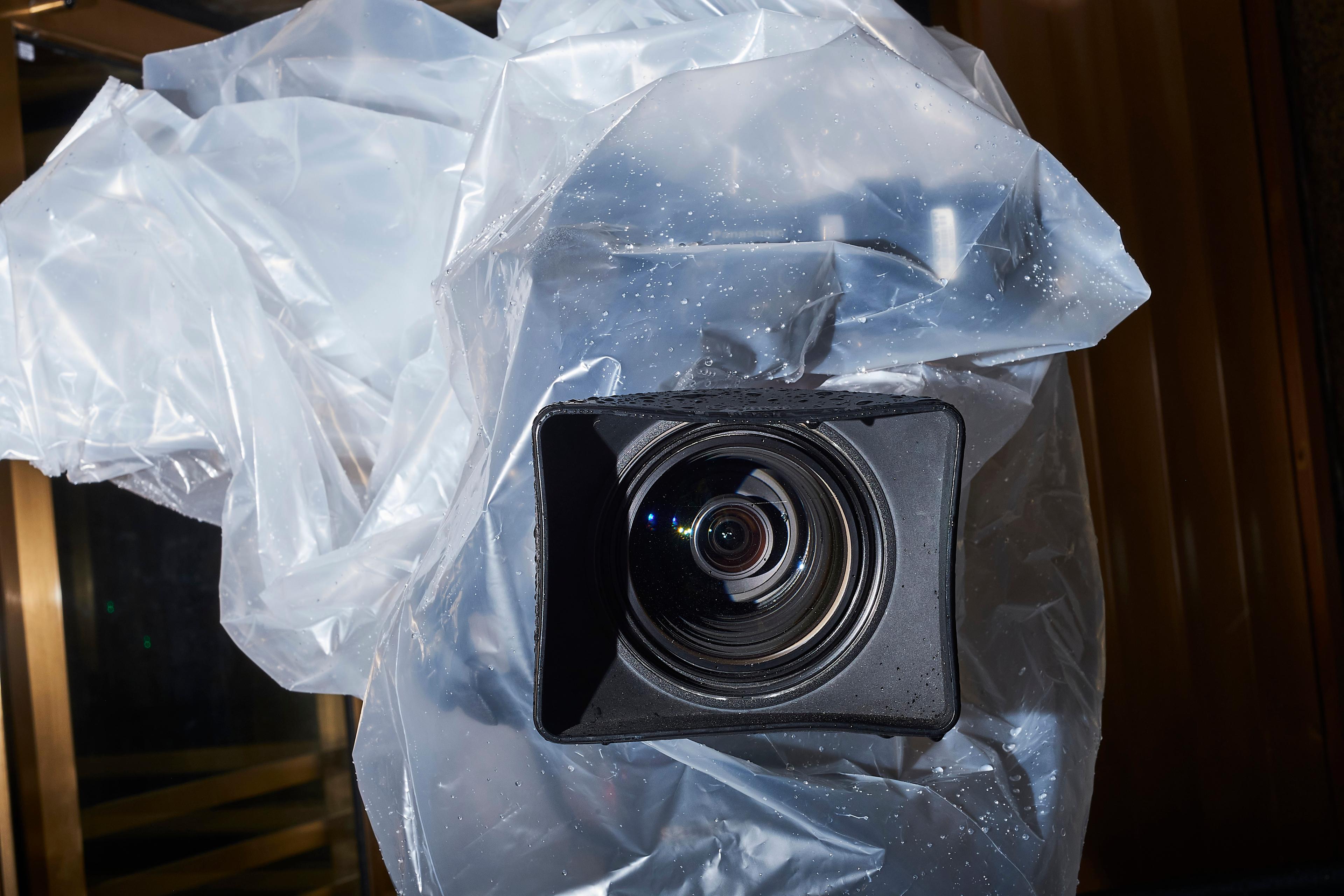 A television camera is protected from rain outside the Manhattan Criminal Court, Jan 16, 2020.