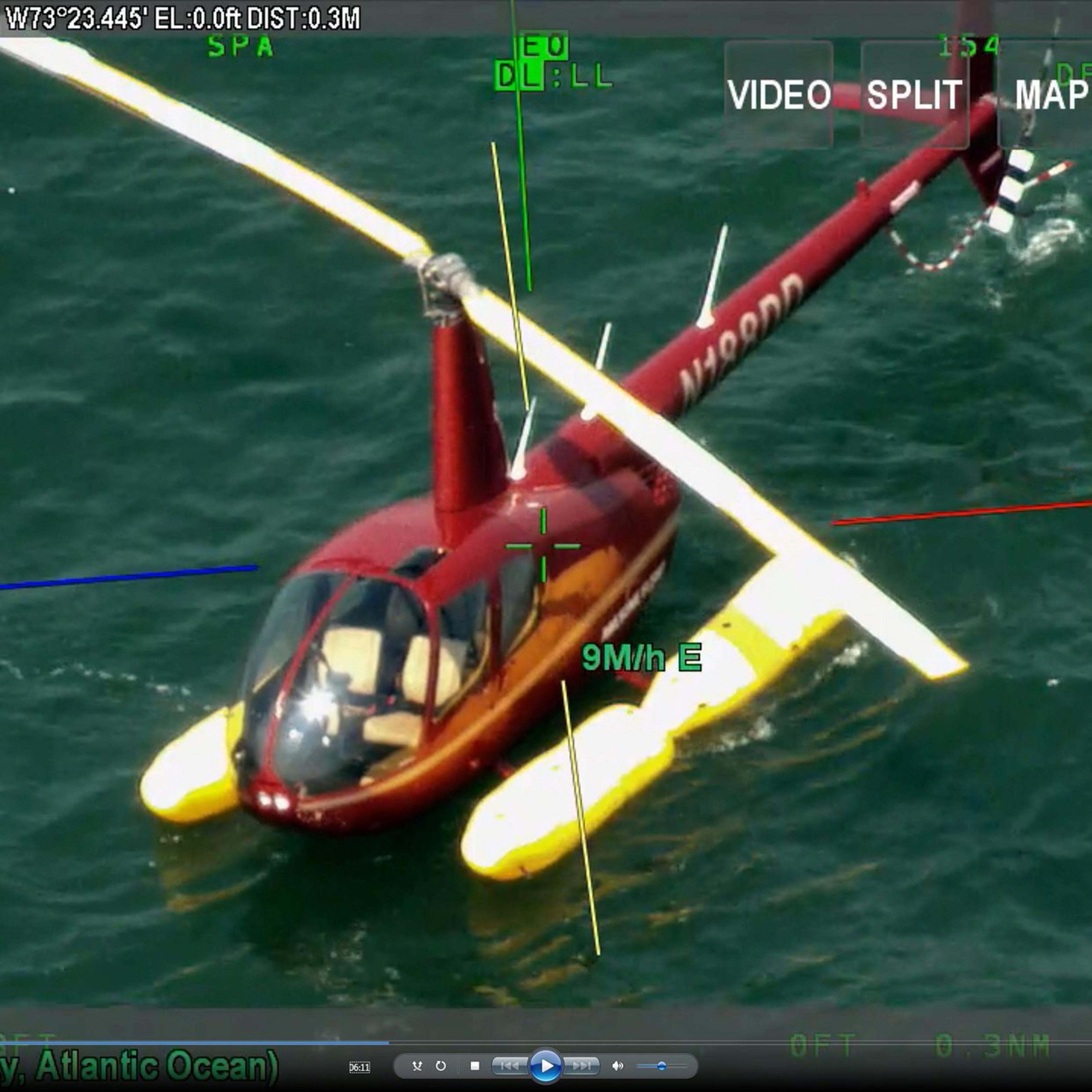 A helicopter which had been carrying Shane McMahon is seen in a still from NYPD video after it landed on water off Long Island