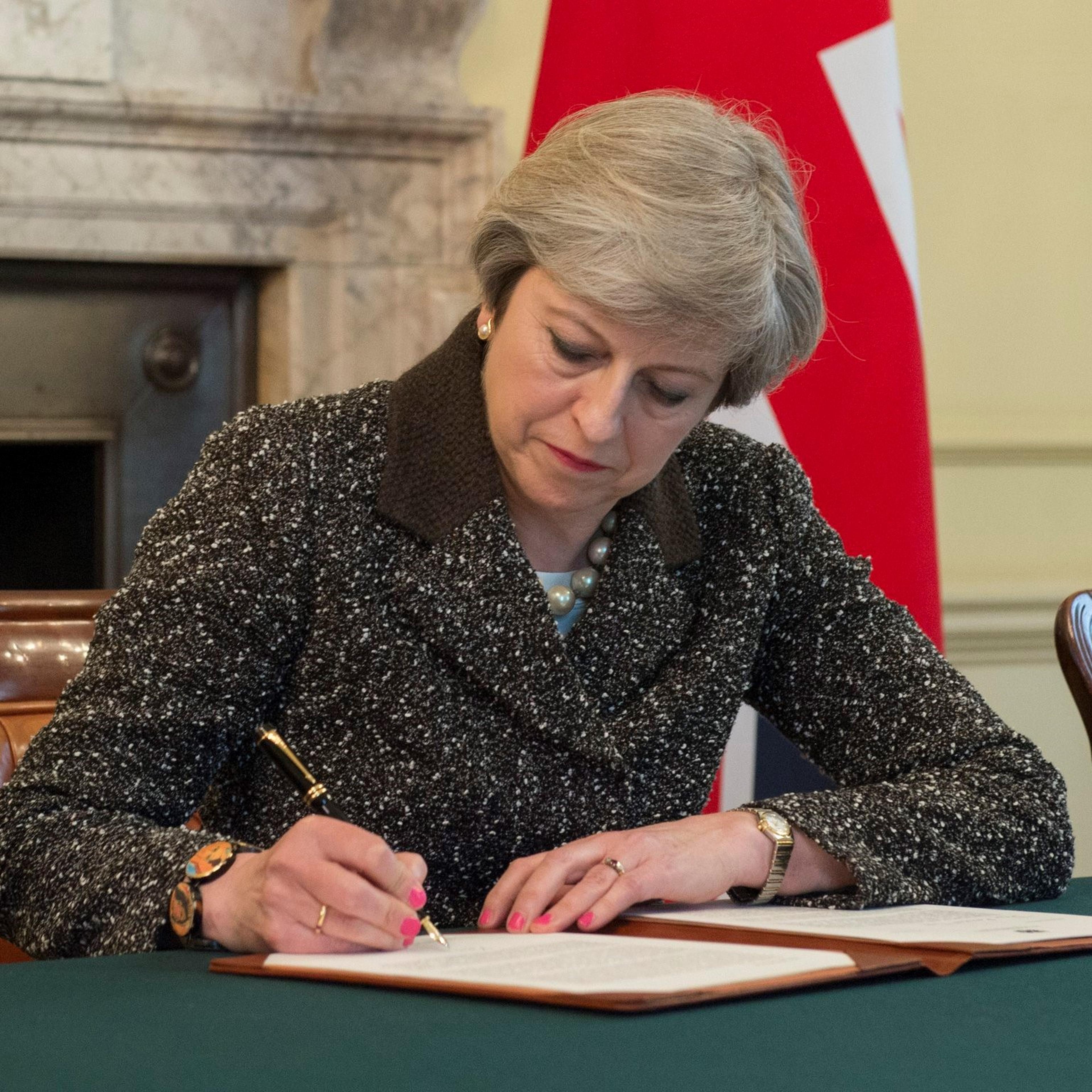 Theresa May signs Brexit letter to EU