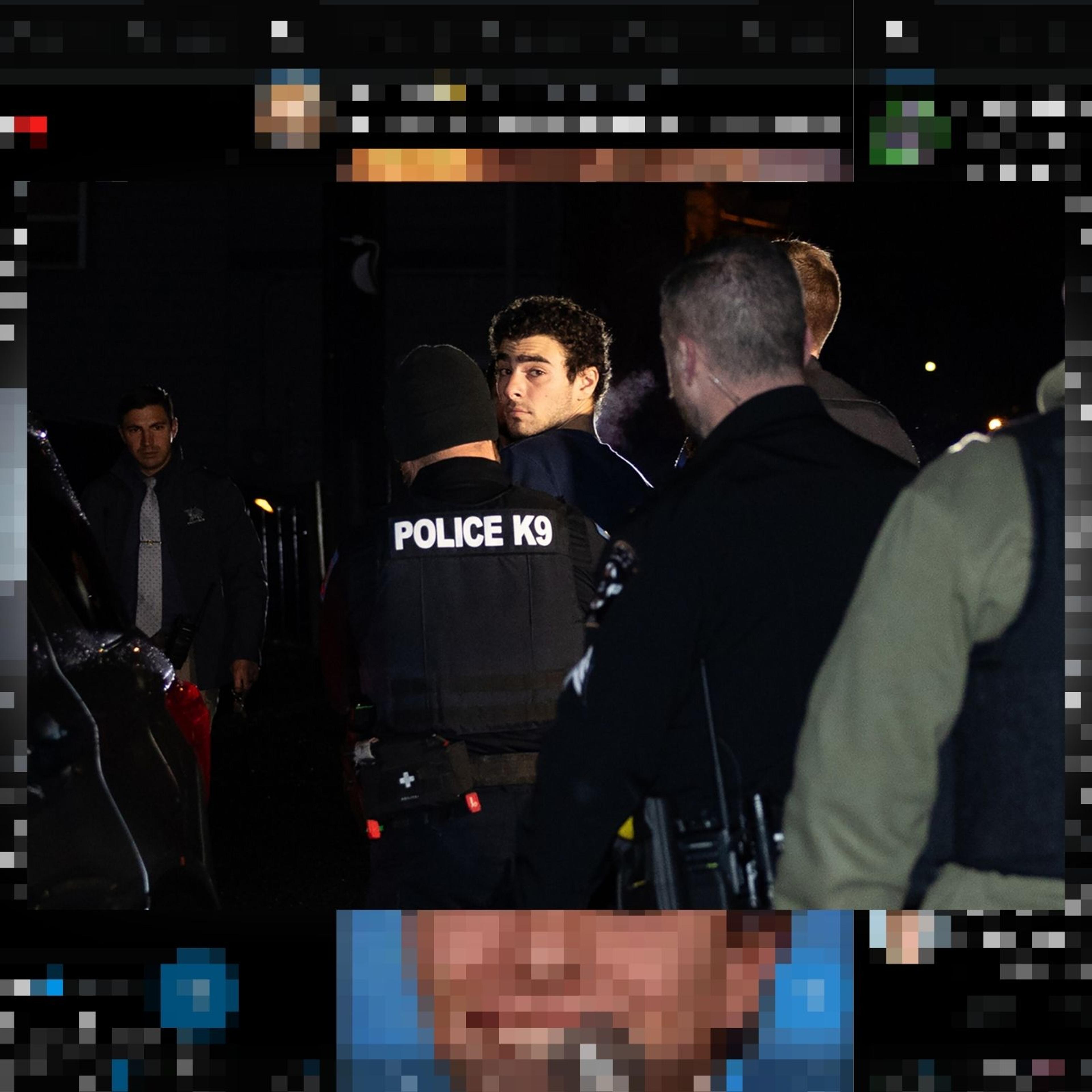 Luigi Mangione is escorted by police to his arraignment at the Blair County Courthouse in Hollidaysburg, Pa., Dec. 9, 2024.