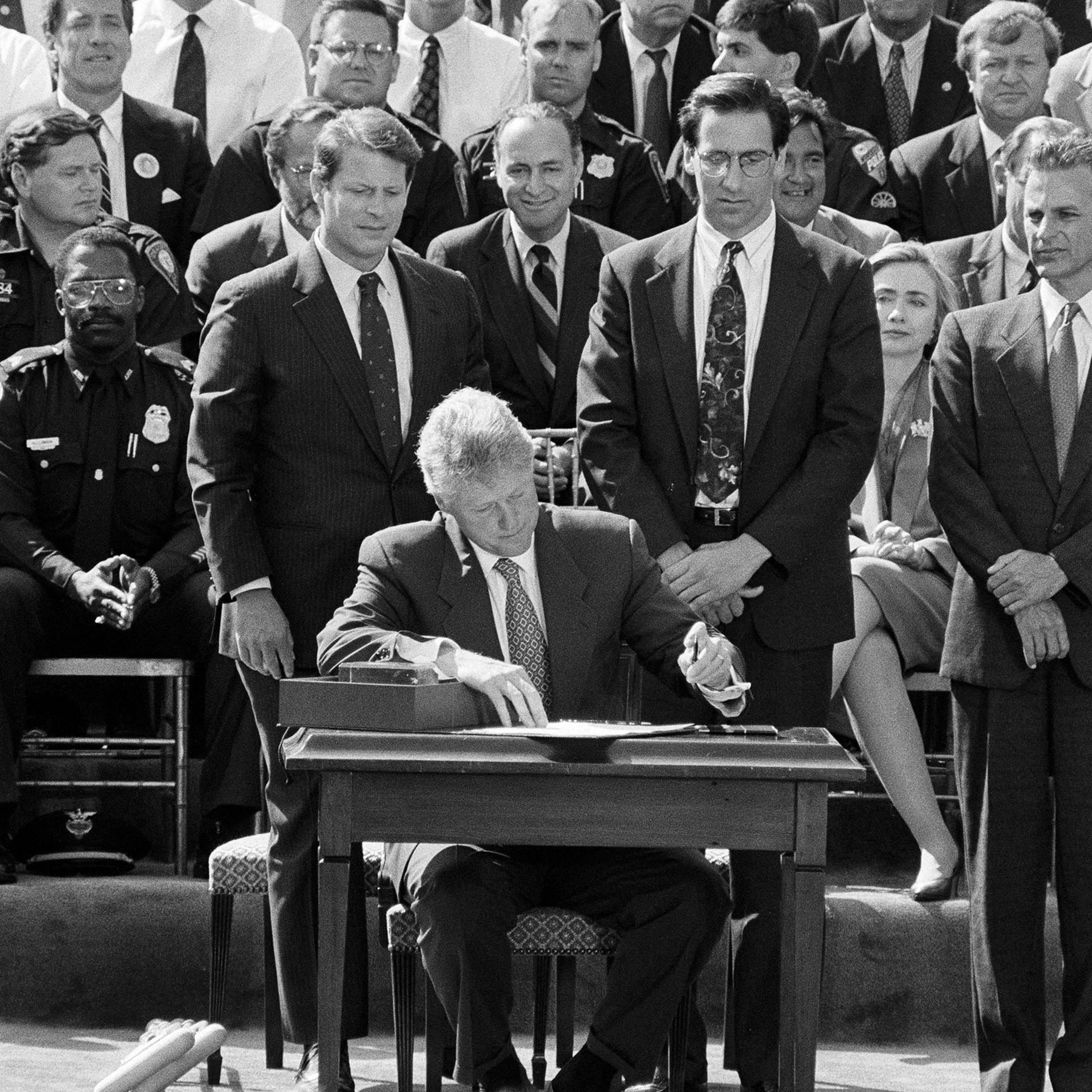 President Clinton signs the Violent Crime Control and Law Enforcement Act at the White House on Sept. 13, 1994.