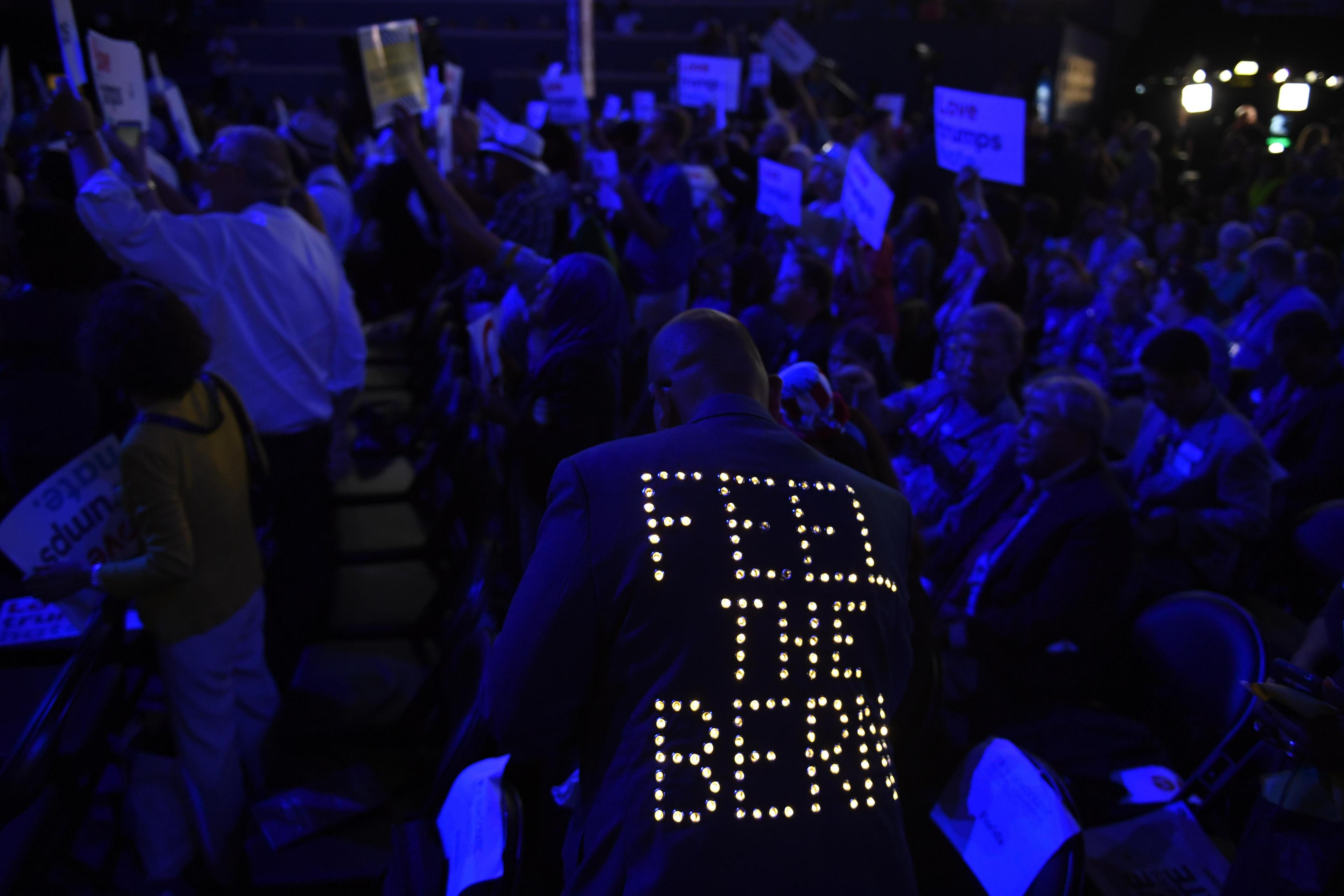 A supporter of Bernie Sanders wears a sequined jacket during the 2016 Democratic National Convention at Wells Fargo Arena.