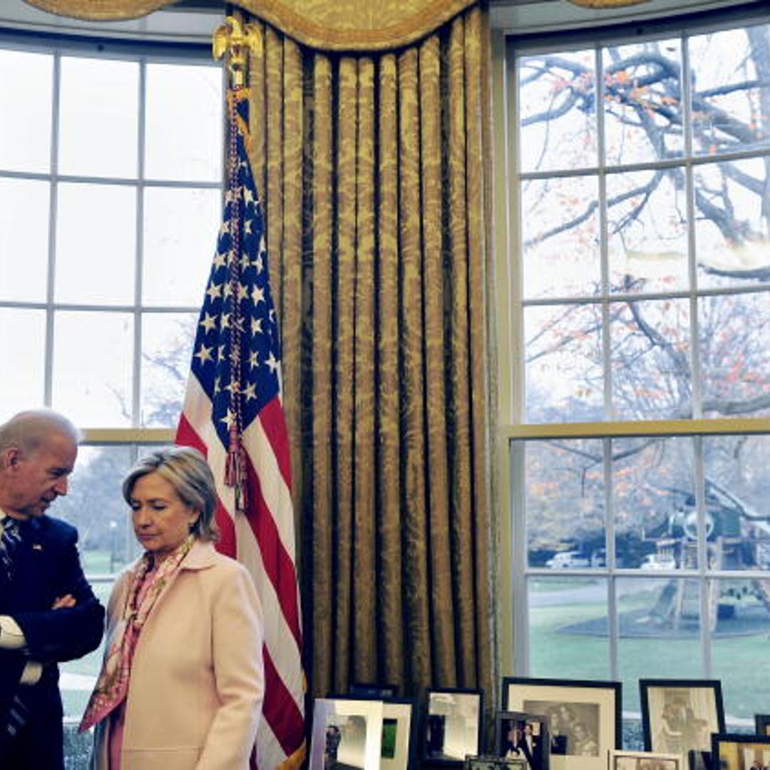 US Vice President Joe Biden (L) talks with Secretary of State Hillary Clinton as US President Barack Obama hosts a meeting with Turkish Prime Minister Recep Tayyip Erdogan in the Oval Office at the White House in Washington, DC, on December 7, 2009.