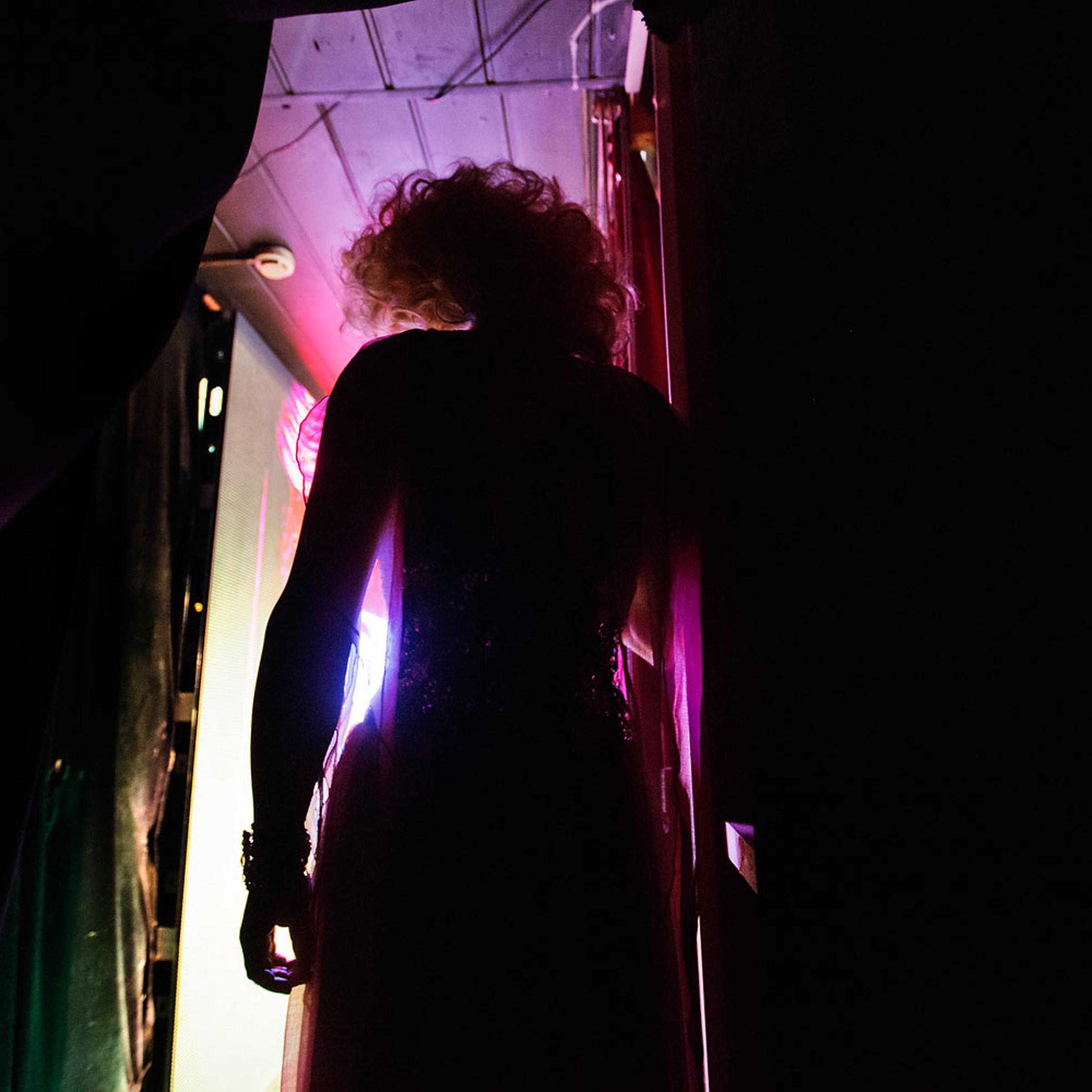 Penelopa, who would only give his stage name, steps out on stage for a performance at the Mayak cabaret in Sochi, Feb. 8, 2014.
