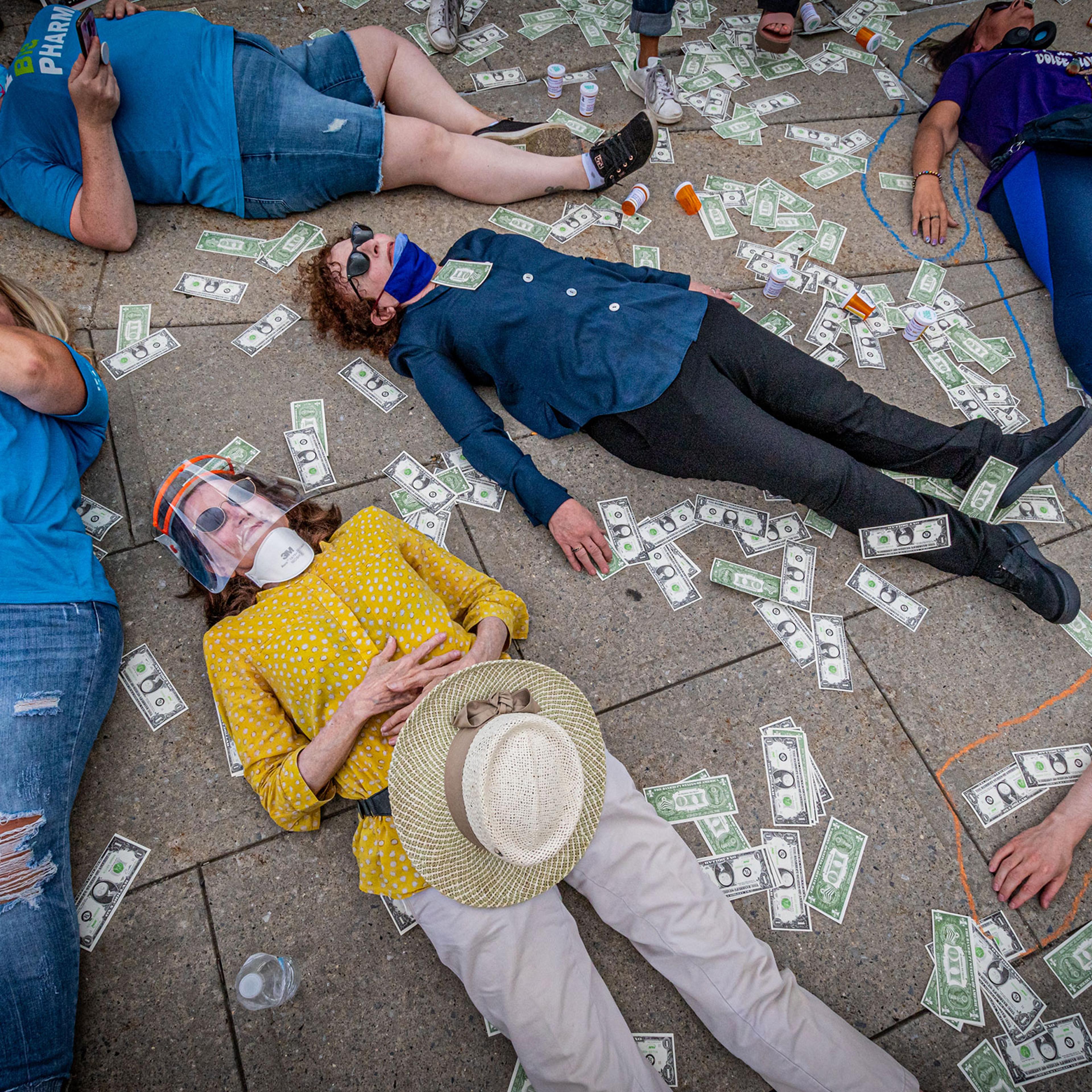 Protesters staging a die-in outside the courthouse. Members