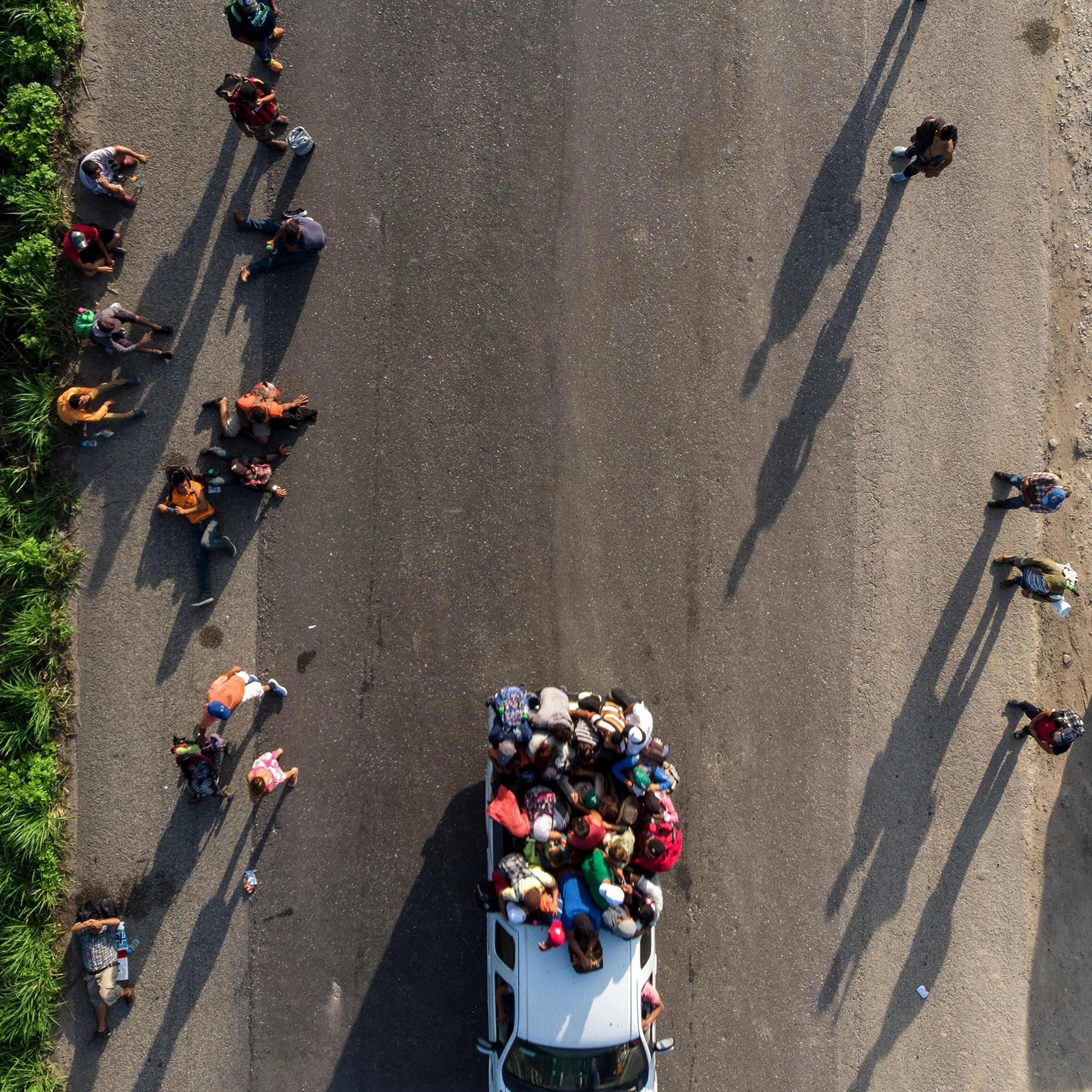 Honduran migrants, part of a caravan to the U.S., resume their march in Oaxaca State, Mexico, on Oct. 29