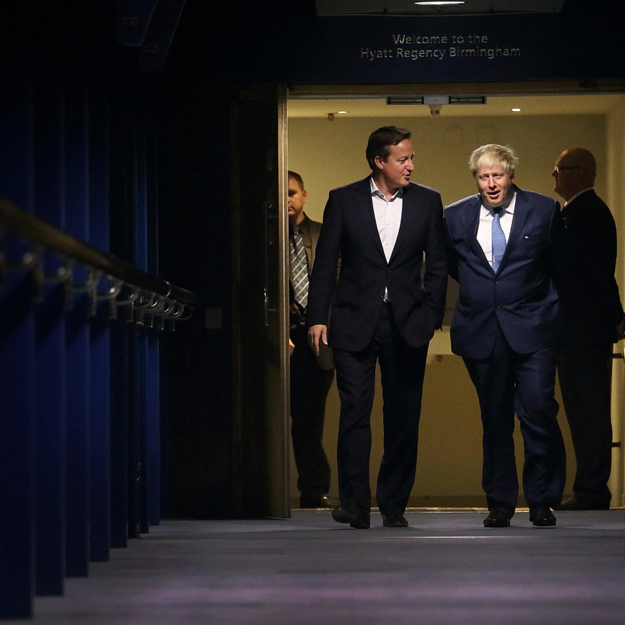 Prime Minister David Cameron walks with Mayor of London and Parliamentary candidate Boris Johnson at the Conservative party conference on Sept. 29, 2014 in Birmingham, England.