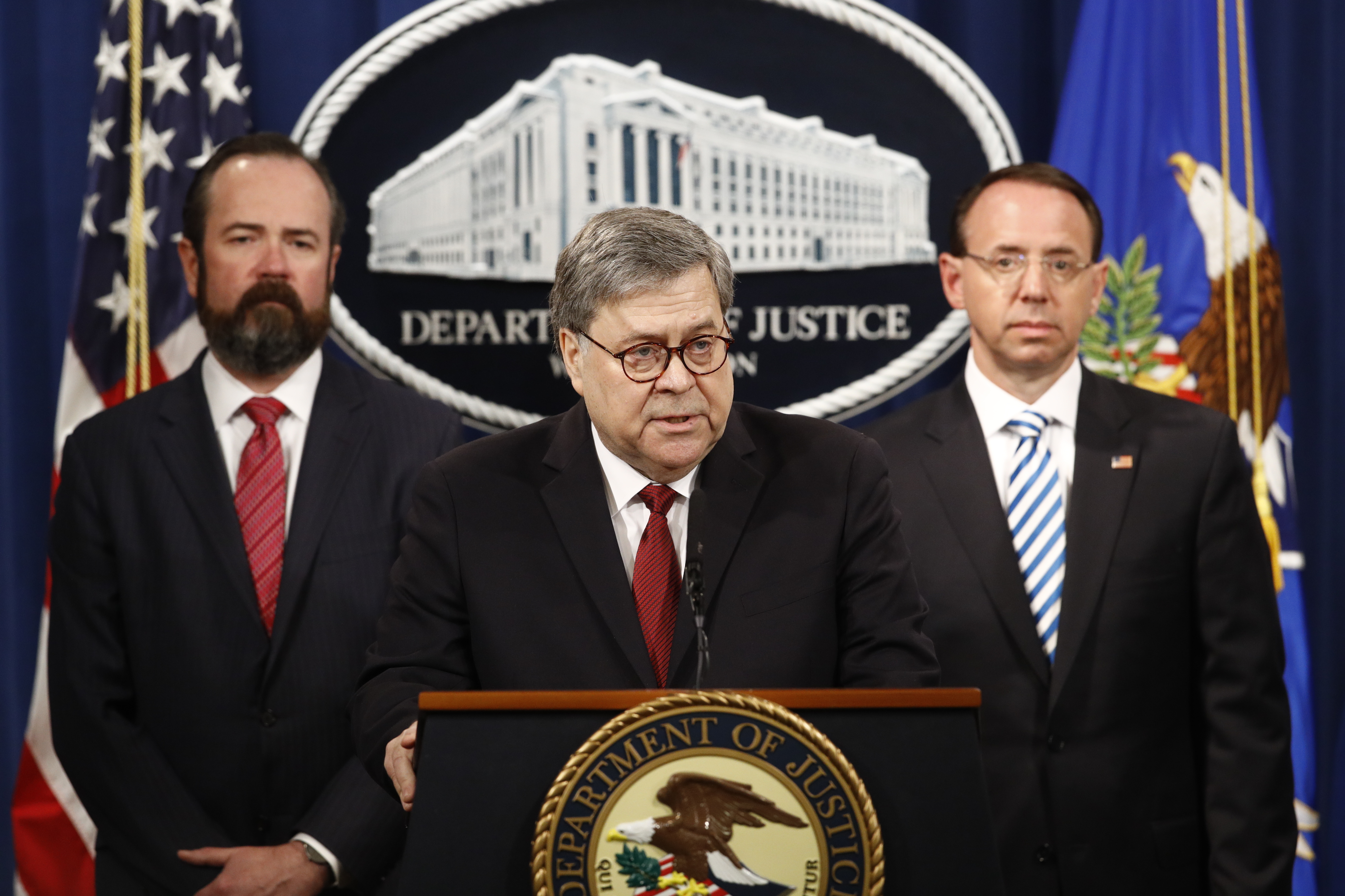 Attorney General William Barr speaks alongside Deputy Attorney General Rod Rosenstein, right and Deputy Attorney General Ed O'Callaghan, left, about the release of a redacted version of special counsel Robert Mueller's report during a news conference, Th