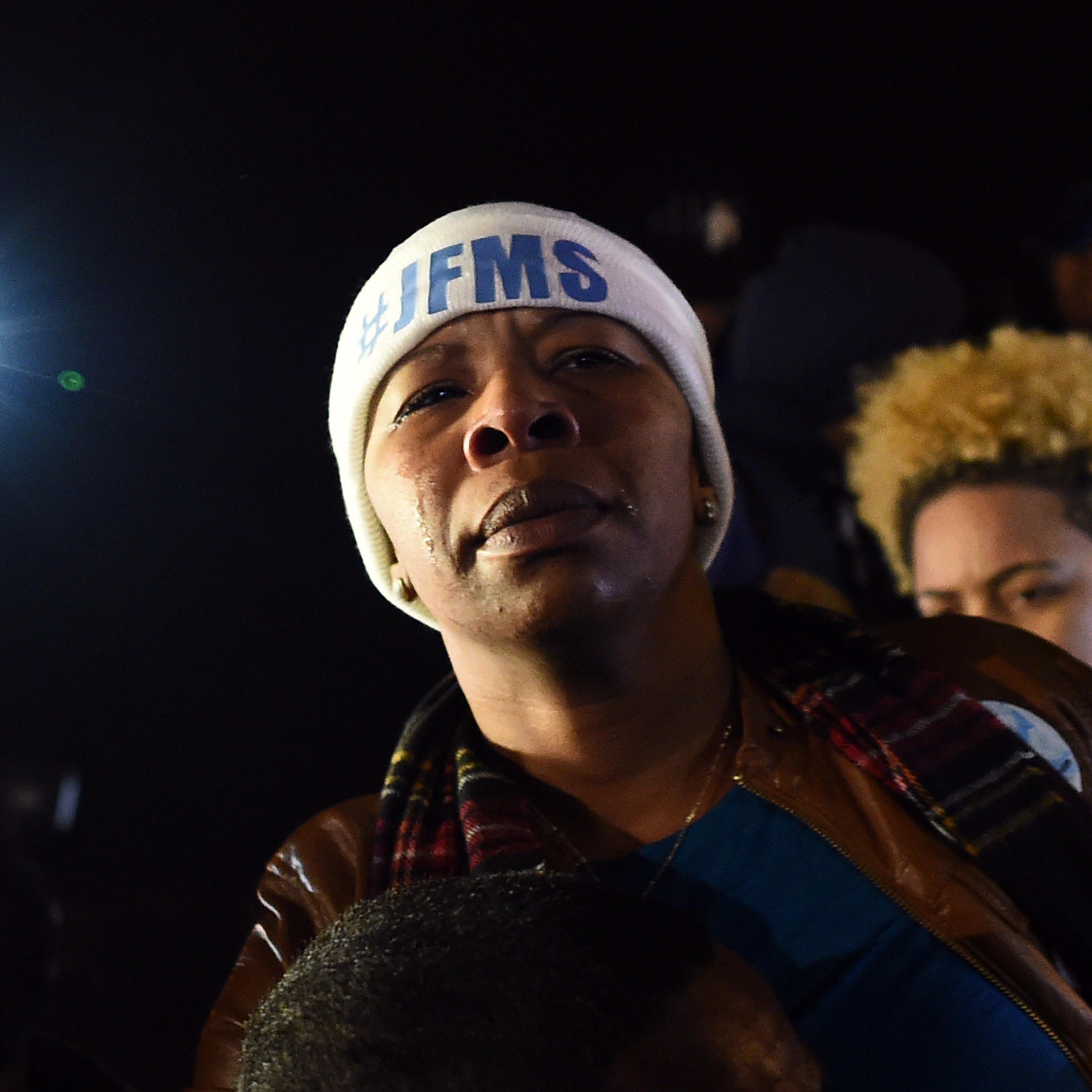 Michael Brown's mother Lesley McSpadden cries outside the police station in Ferguson, Mo. on Nov. 24, 2014 after hearing the grand jury decision on her son's fatal shooting.