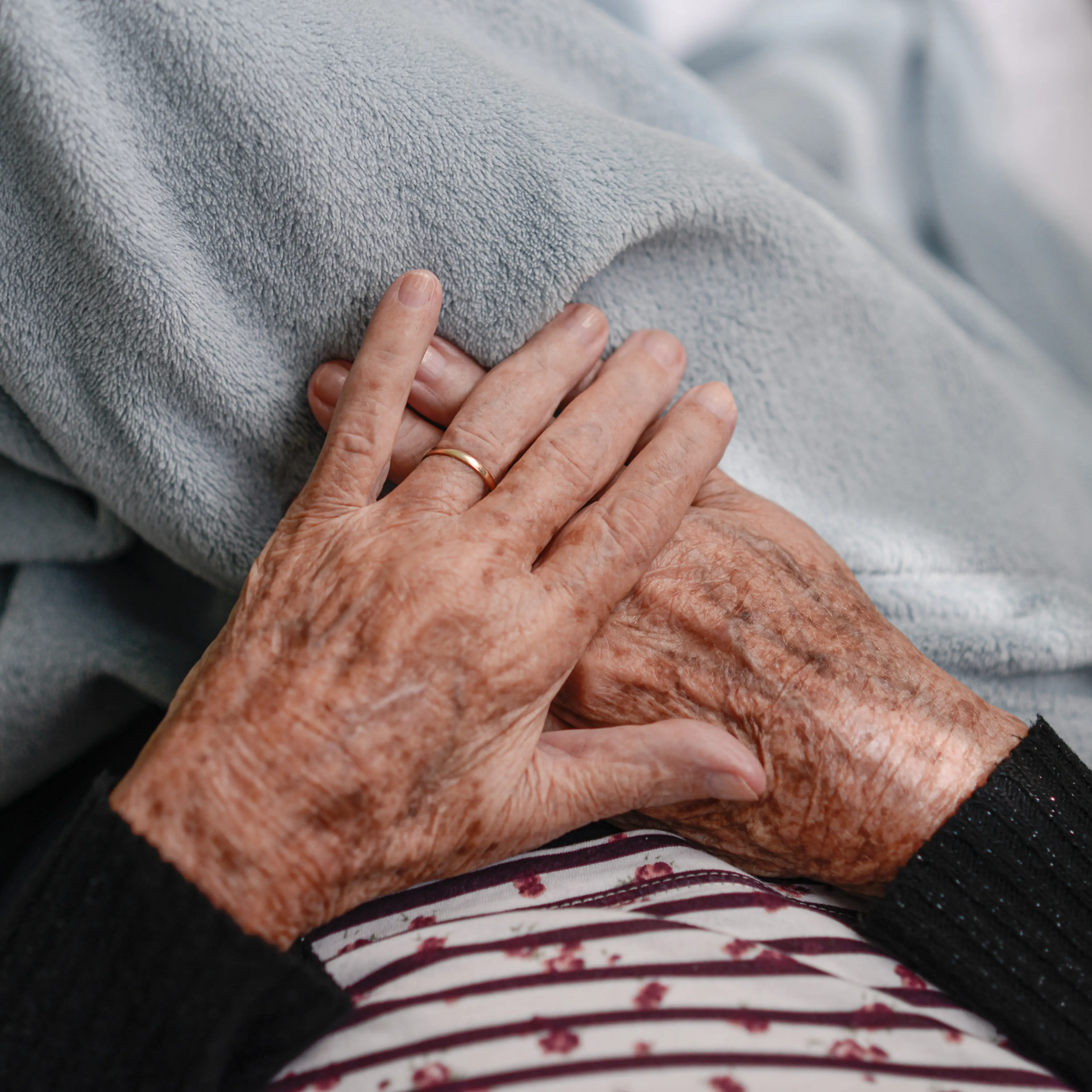 Hands of an elderly woman resting