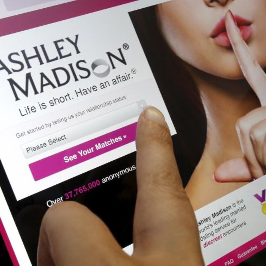 Homepage of Ashley Madison website displayed on iPad, in photo illustration taken in Ottawa