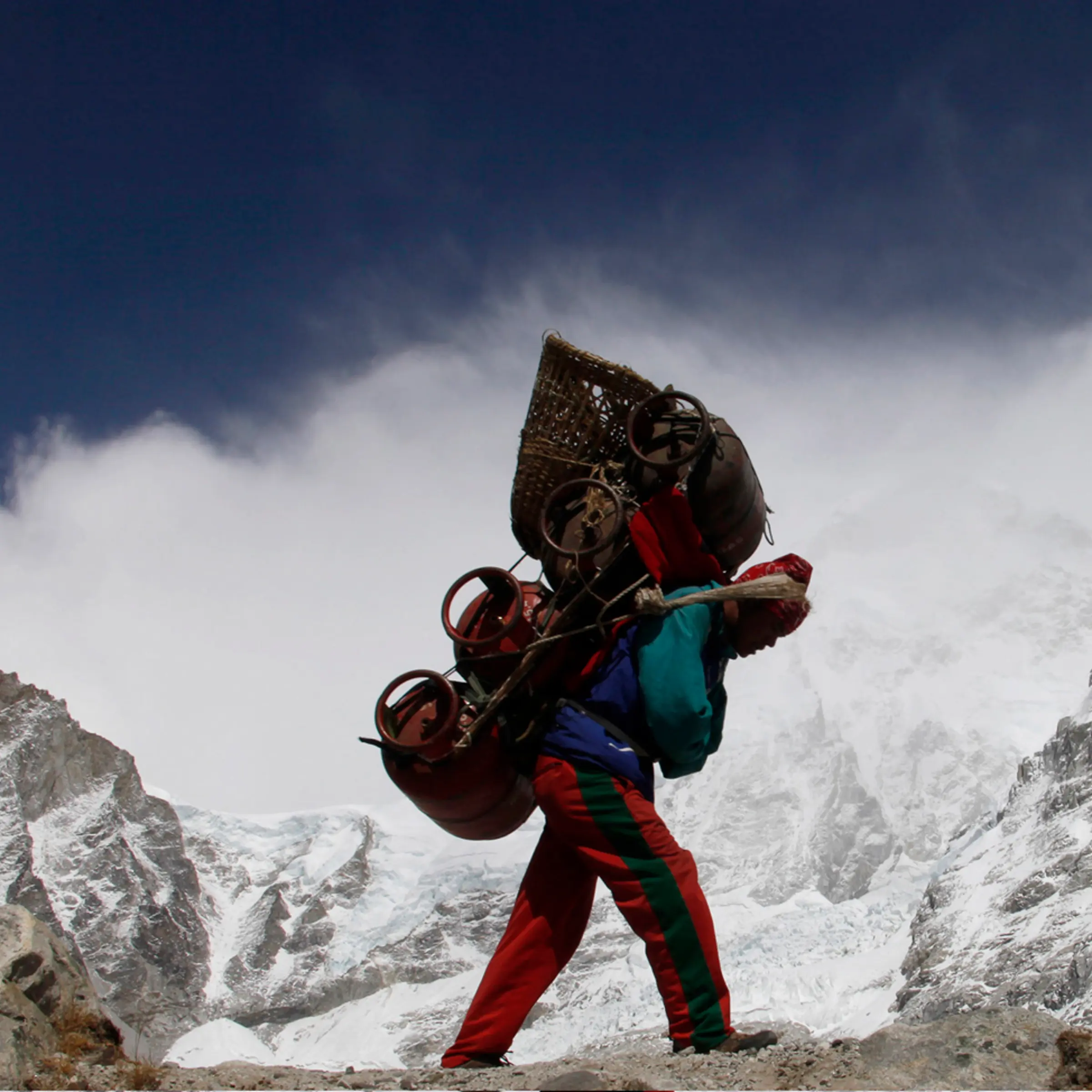 A Nepalese porter walks with his load from Everest base camp in Nepal