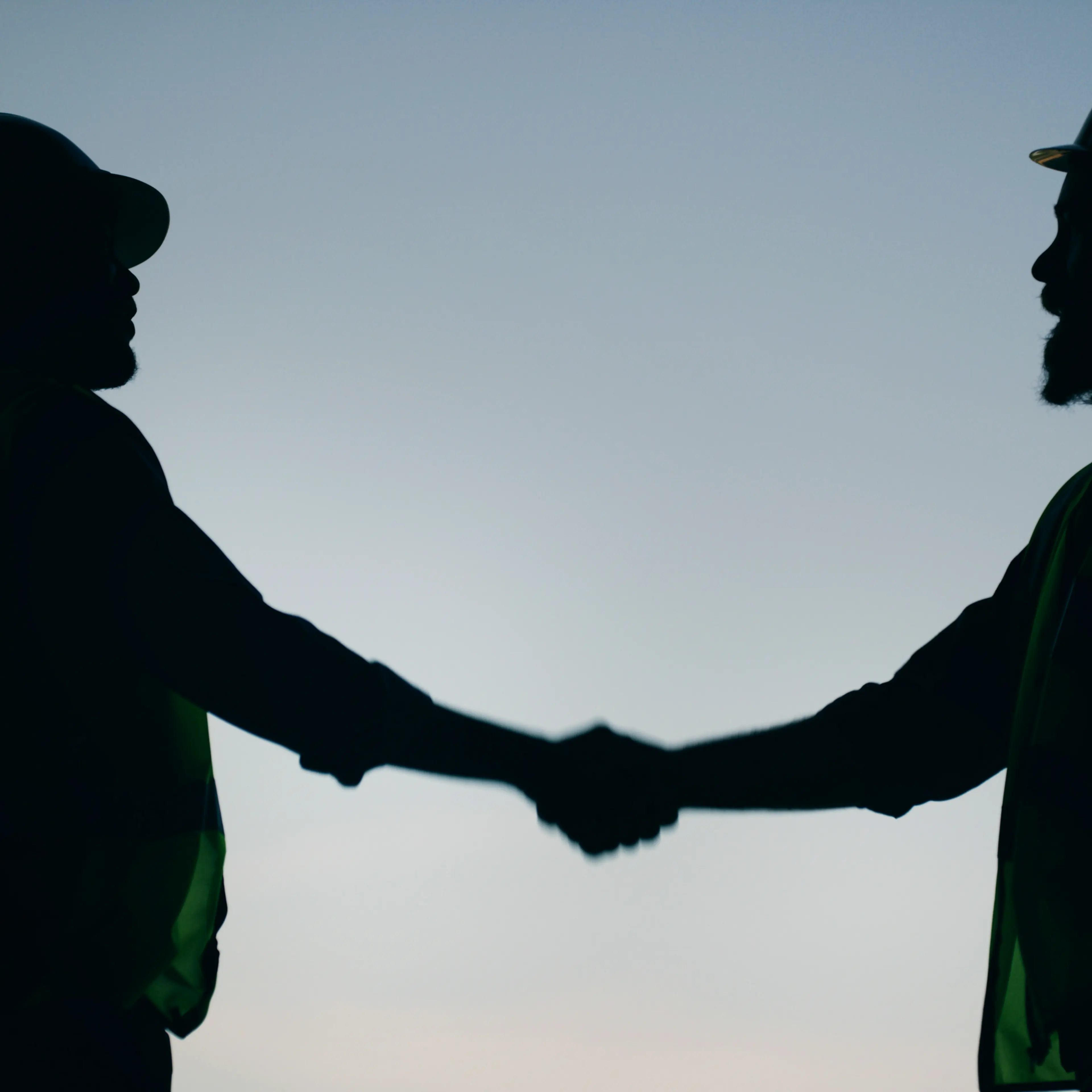 Two people shake hands