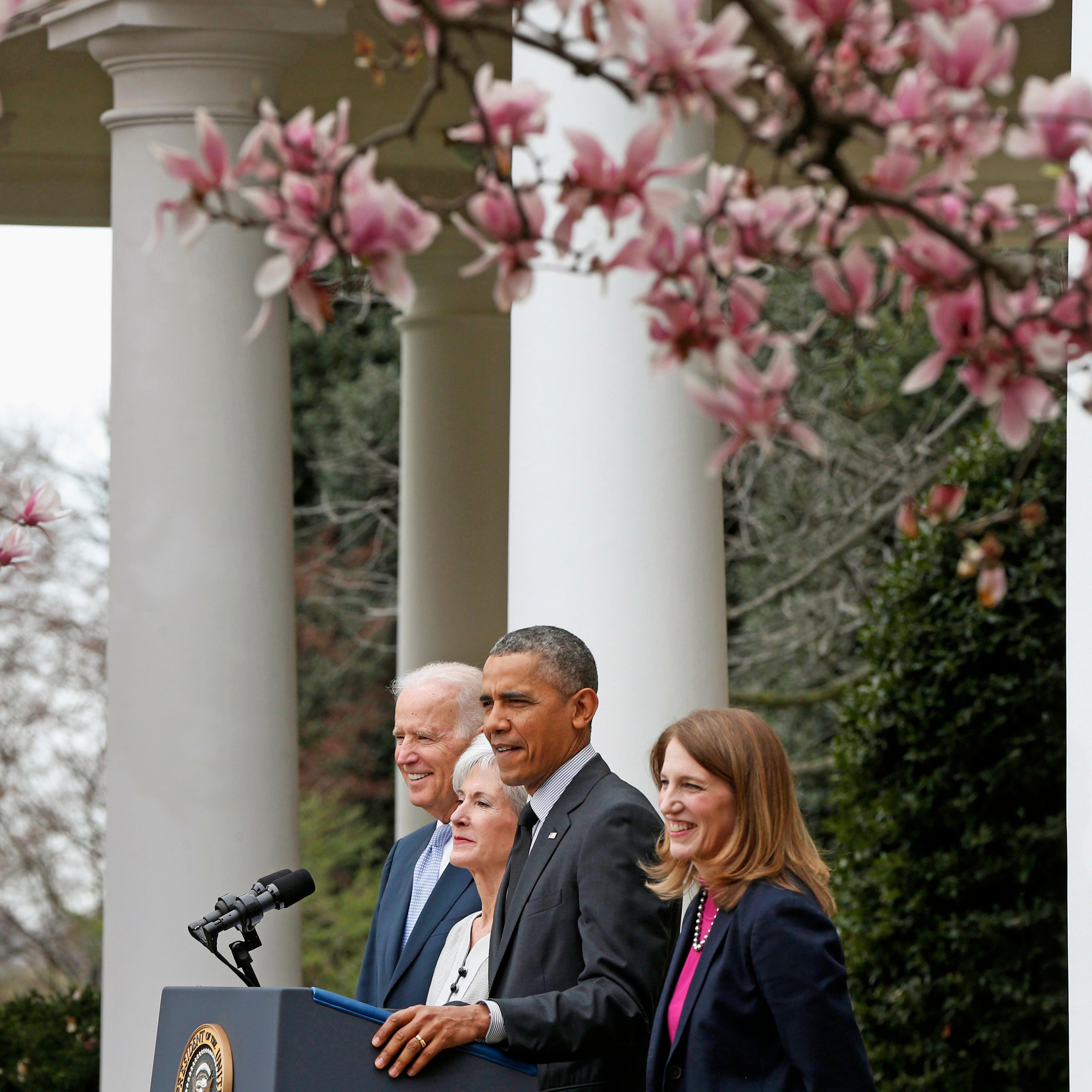U.S. President Barack Obama and Vice President Joe Biden stand with outgoing Health and Human Services Secretary Kathleen Sebelius (second from left) and his nominee to be her replacement, Budget Director Sylvia Mathews Burwell in the Rose Garden of the