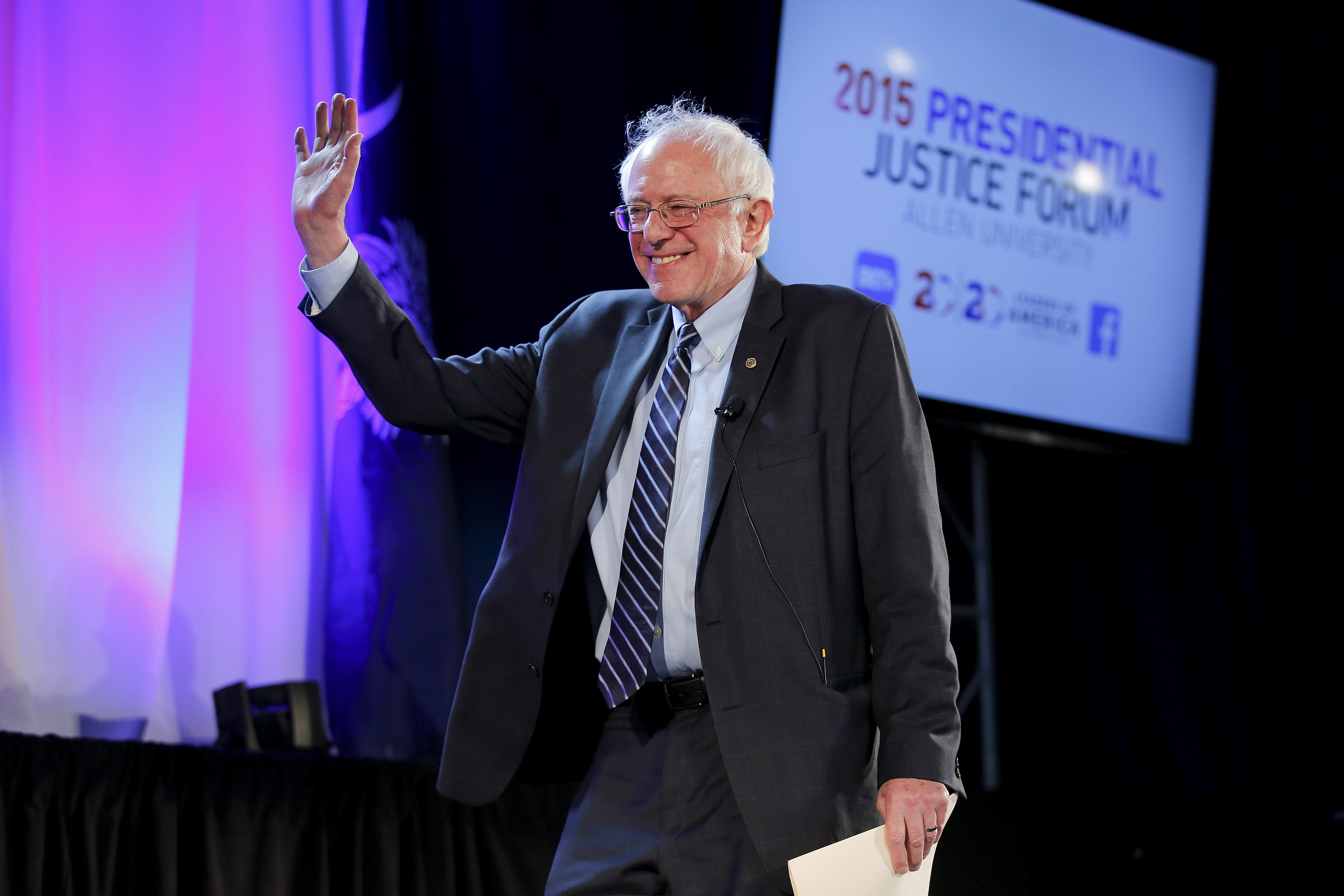 U.S. Democratic presidential candidate Bernie Sanders waves as he walks onto the stage during the 20/20 Club Presidential Justice Forum at Allen University in Columbia