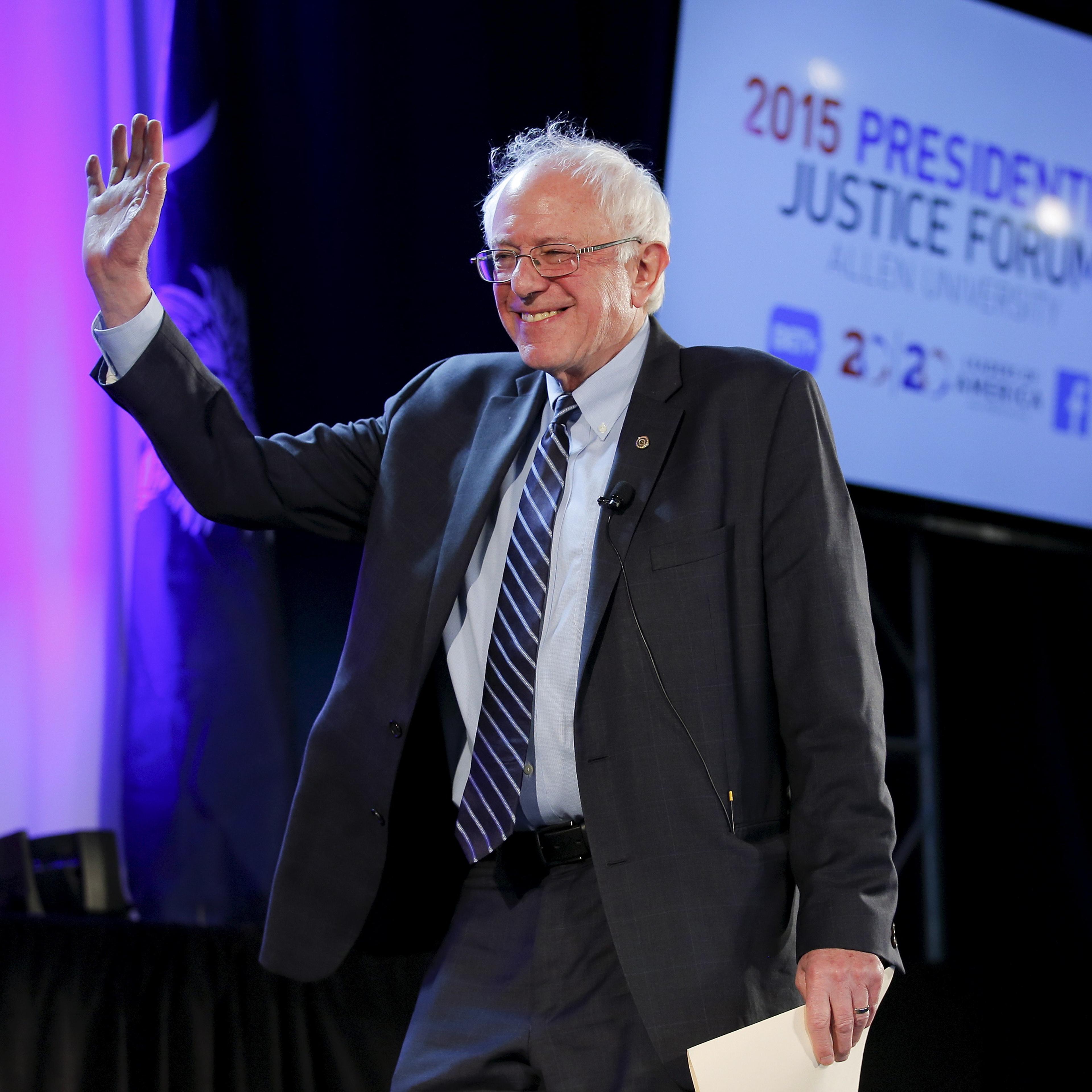 U.S. Democratic presidential candidate Bernie Sanders waves as he walks onto the stage during the 20/20 Club Presidential Justice Forum at Allen University in Columbia