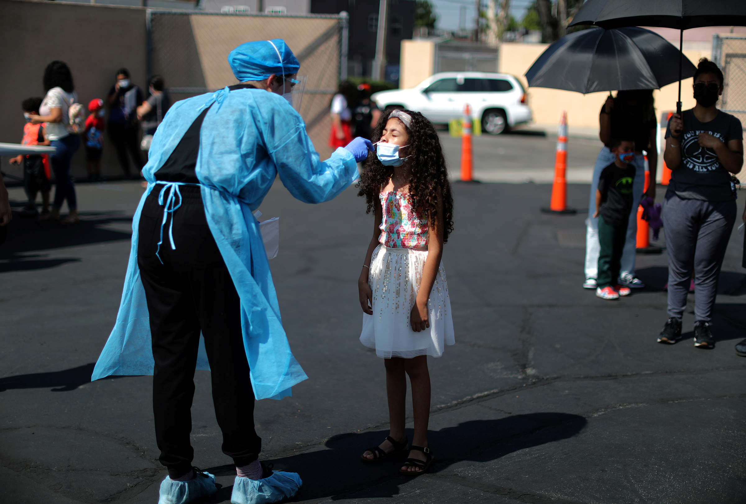 Alisson Argueta, 8, is given a COVID-19 test at a back-to-school clinic in South Gate, Los Angeles, on Aug. 12.