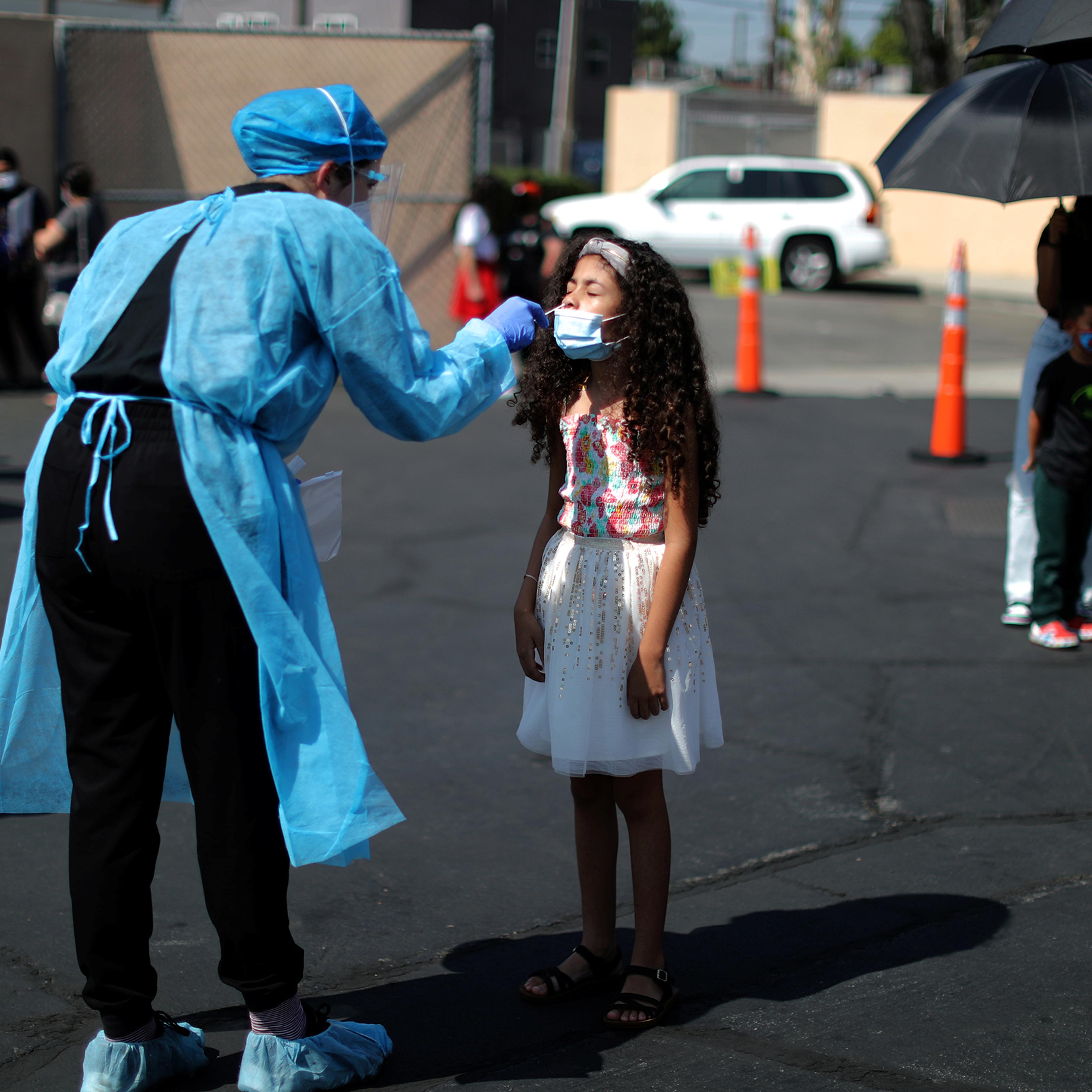 Alisson Argueta, 8, is given a COVID-19 test at a back-to-school clinic in South Gate, Los Angeles, on Aug. 12.