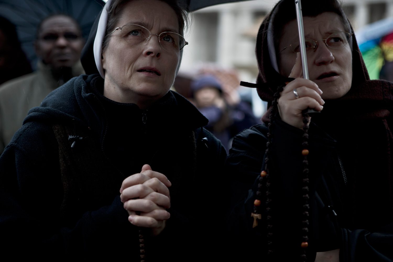 <b><i>The following photographs were taken in St. Peter's Square, Rome, on March 12th and 13th, 2013.</i></b> <br><br> Nuns wait in the rain at the start of the Conclave in Vatican City.