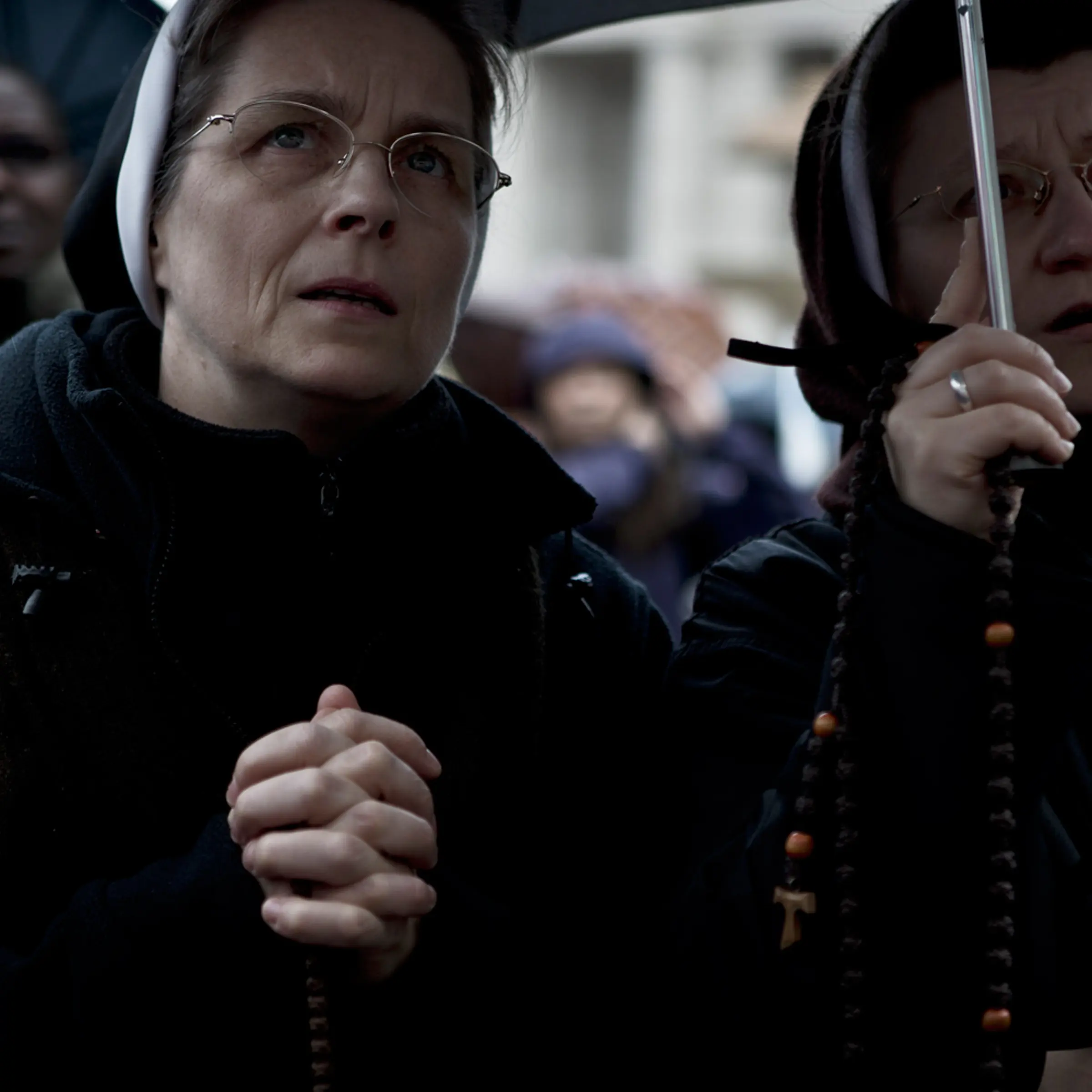 <b><i>The following photographs were taken in St. Peter's Square, Rome, on March 12th and 13th, 2013.</i></b> <br><br> Nuns wait in the rain at the start of the Conclave in Vatican City.