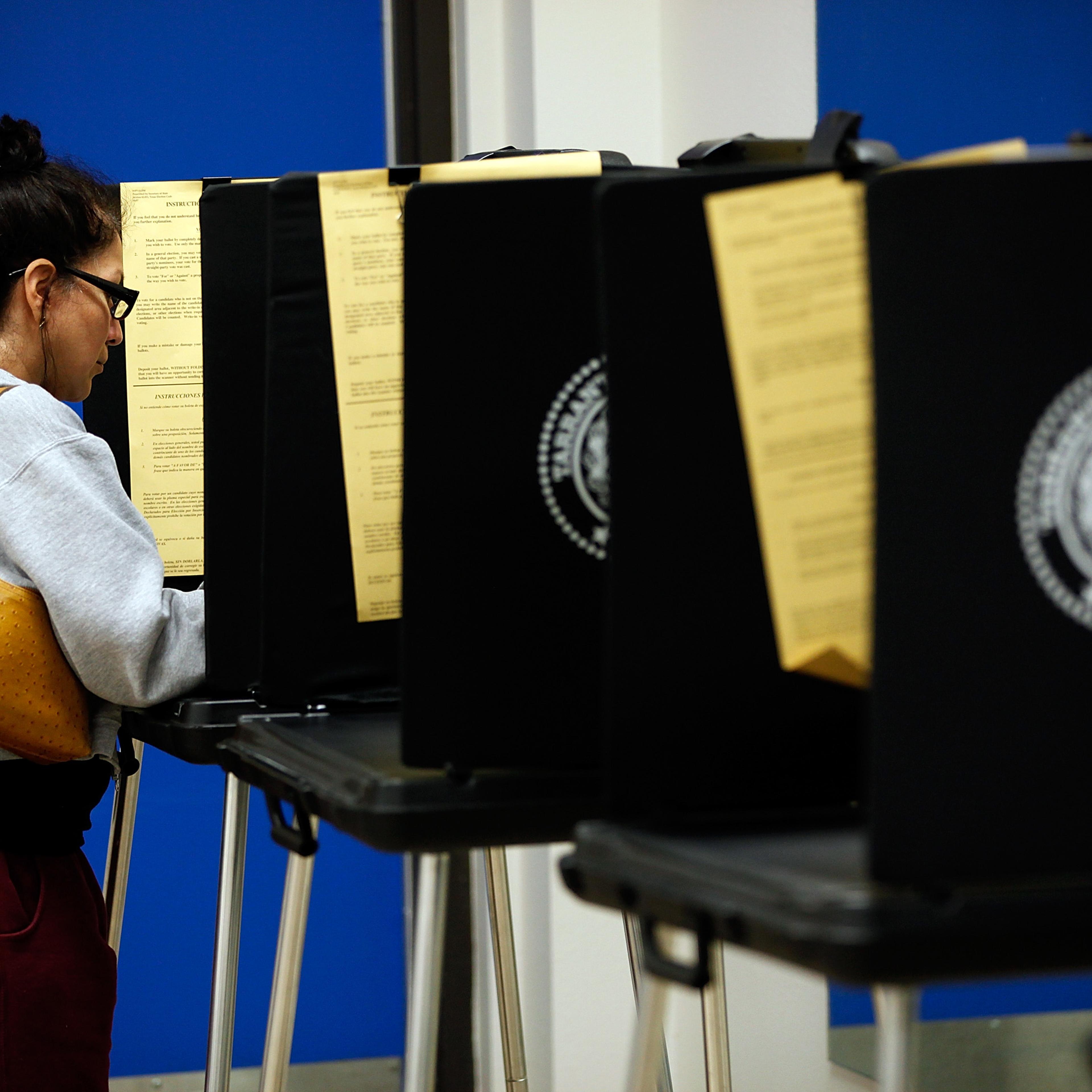 A voter completes her ballot on November 6, 2012 in Fort Worth, Texas.