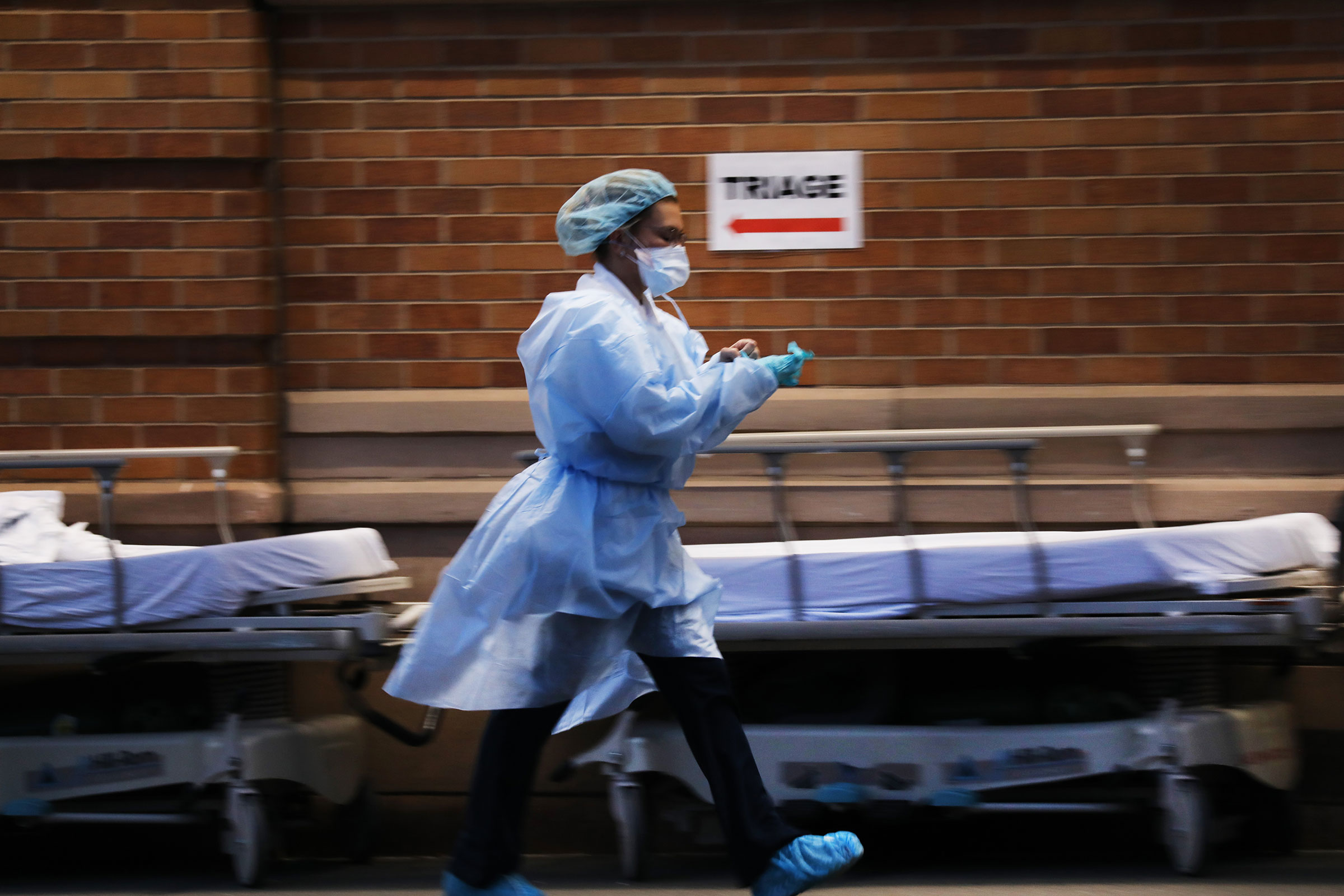 Medical workers wait for patients at a special coronavirus intake area at Maimonides Medical Center in the Borough Park section of Brooklyn
