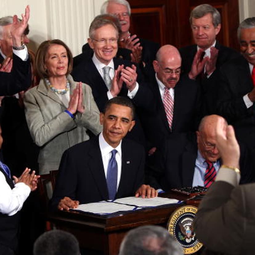 U.S. President Barack Obama is applauded after signing the Affordable Health Care for America Act during a ceremony with fellow Democrats in the East Room of the White House March 23, 2010 in Washington, DC.