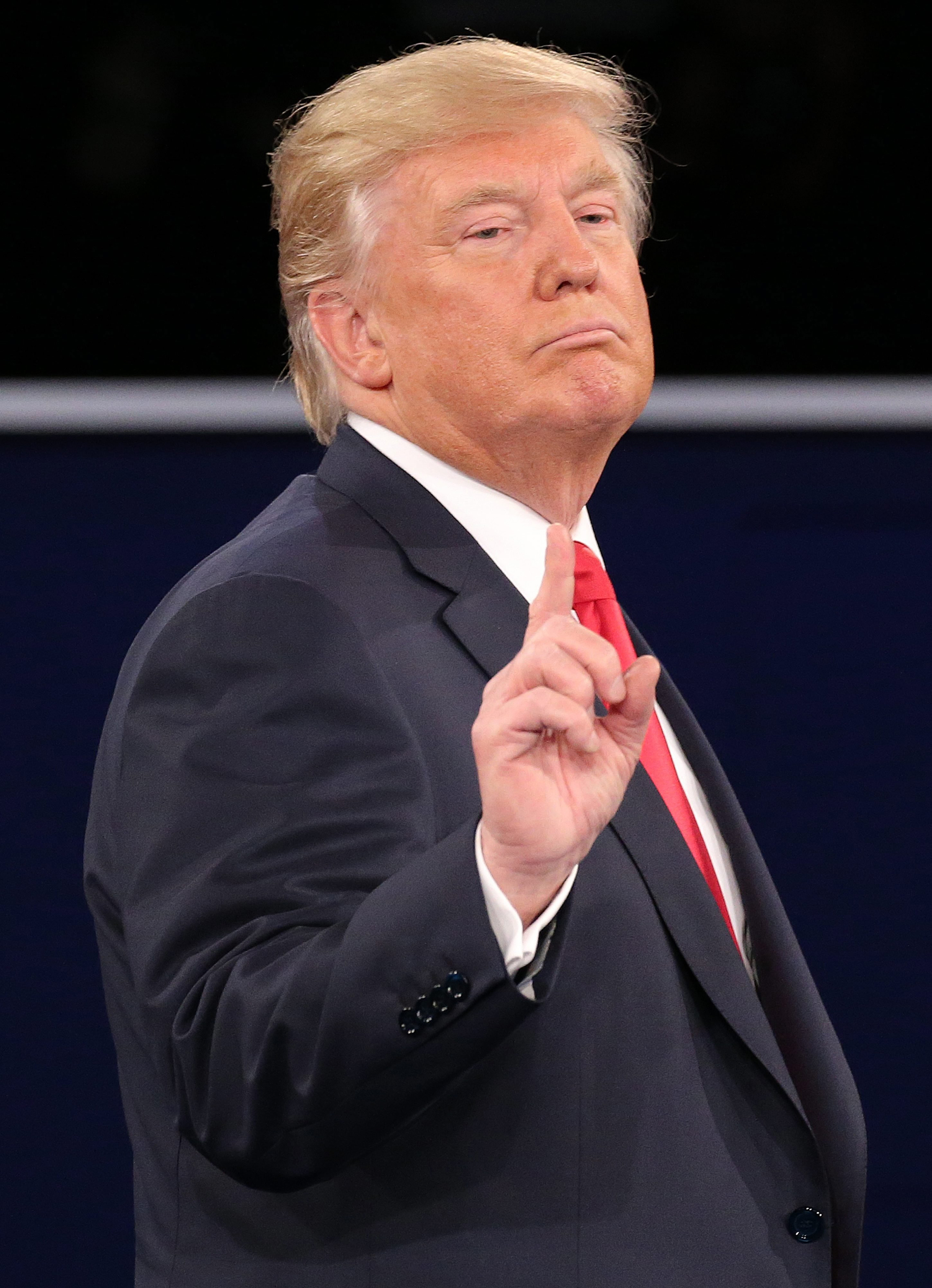 epa05579107 Republican Donald Trump during the second Presidential Debate at Washington University in St. Louis, Missouri, USA, 09 October 2016. The third and final debate will be held 19 October in Nevada. EPA/GARY HE