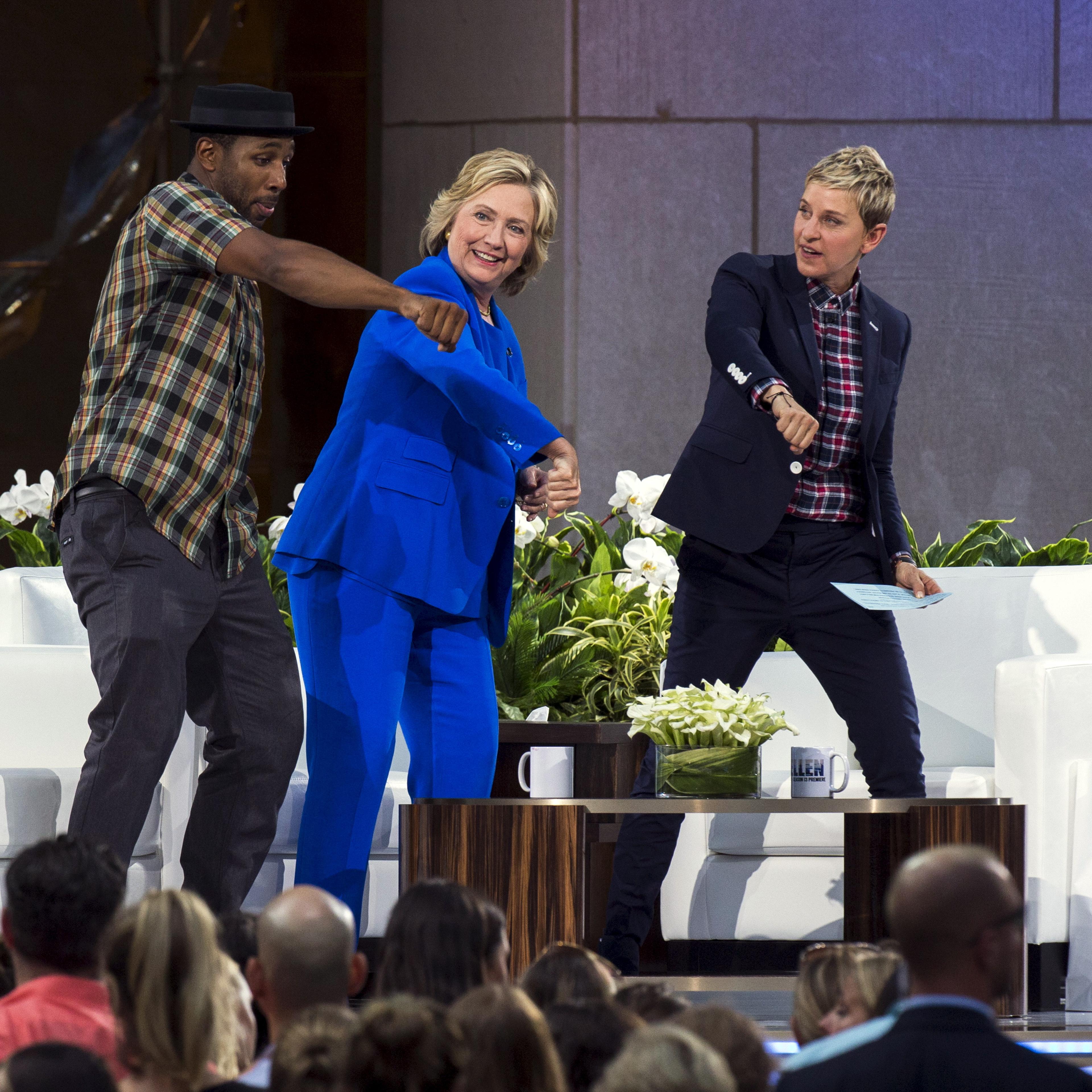 Hillary Clinton dances with DJ "Twitch" and Ellen DeGeneres during a taping of "The Ellen DeGeneres Show" in New York