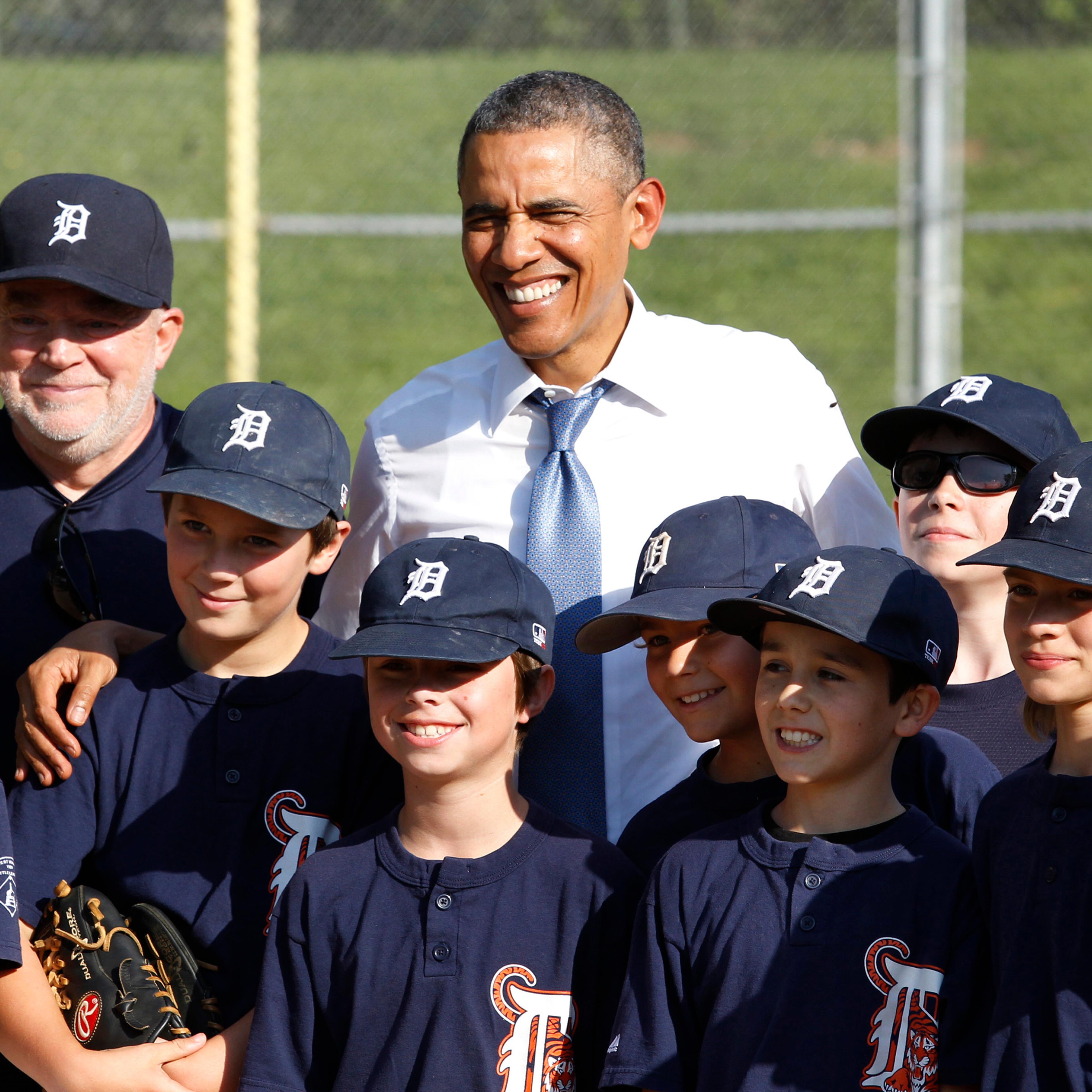 U.S. President Barack Obama poses with Little League baseball players and their coach at Friendship Park in Washington