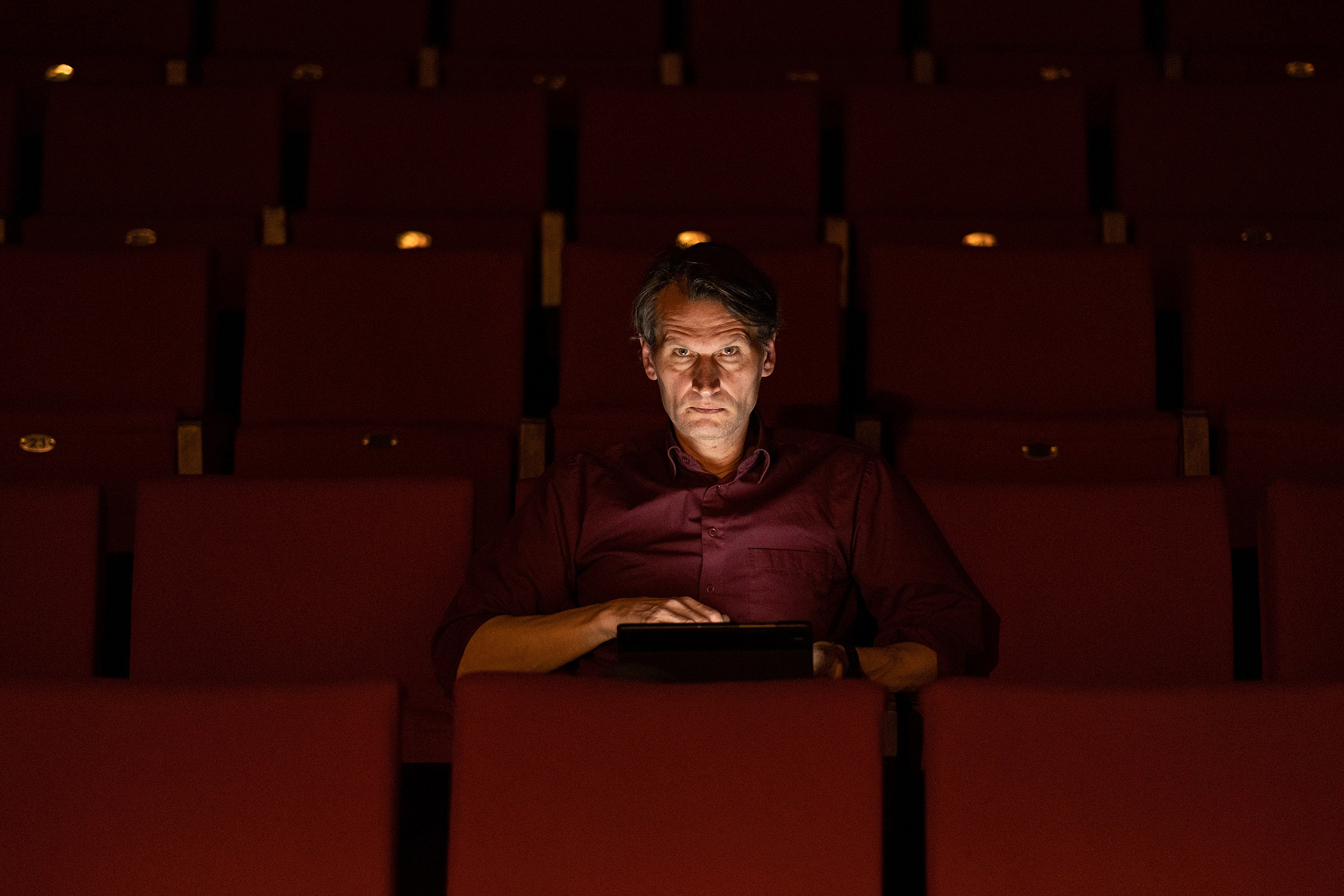 Kaunas Drama Theatre actor, Riflemen's Union member and elf Henrikas Savickis browses through social media posts about current events in Ukraine. Kaunas, Lithuania.