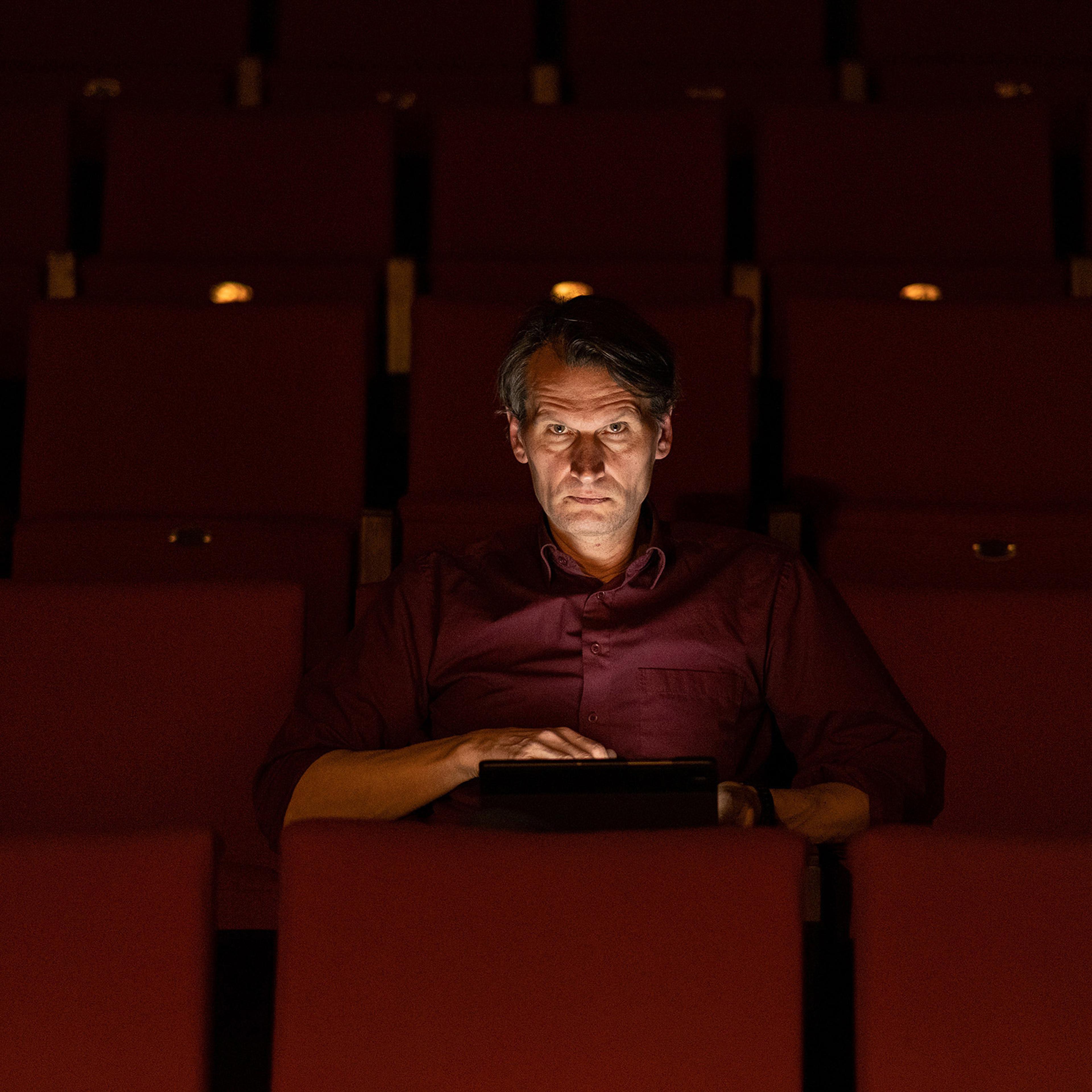 Kaunas Drama Theatre actor, Riflemen's Union member and elf Henrikas Savickis browses through social media posts about current events in Ukraine. Kaunas, Lithuania.