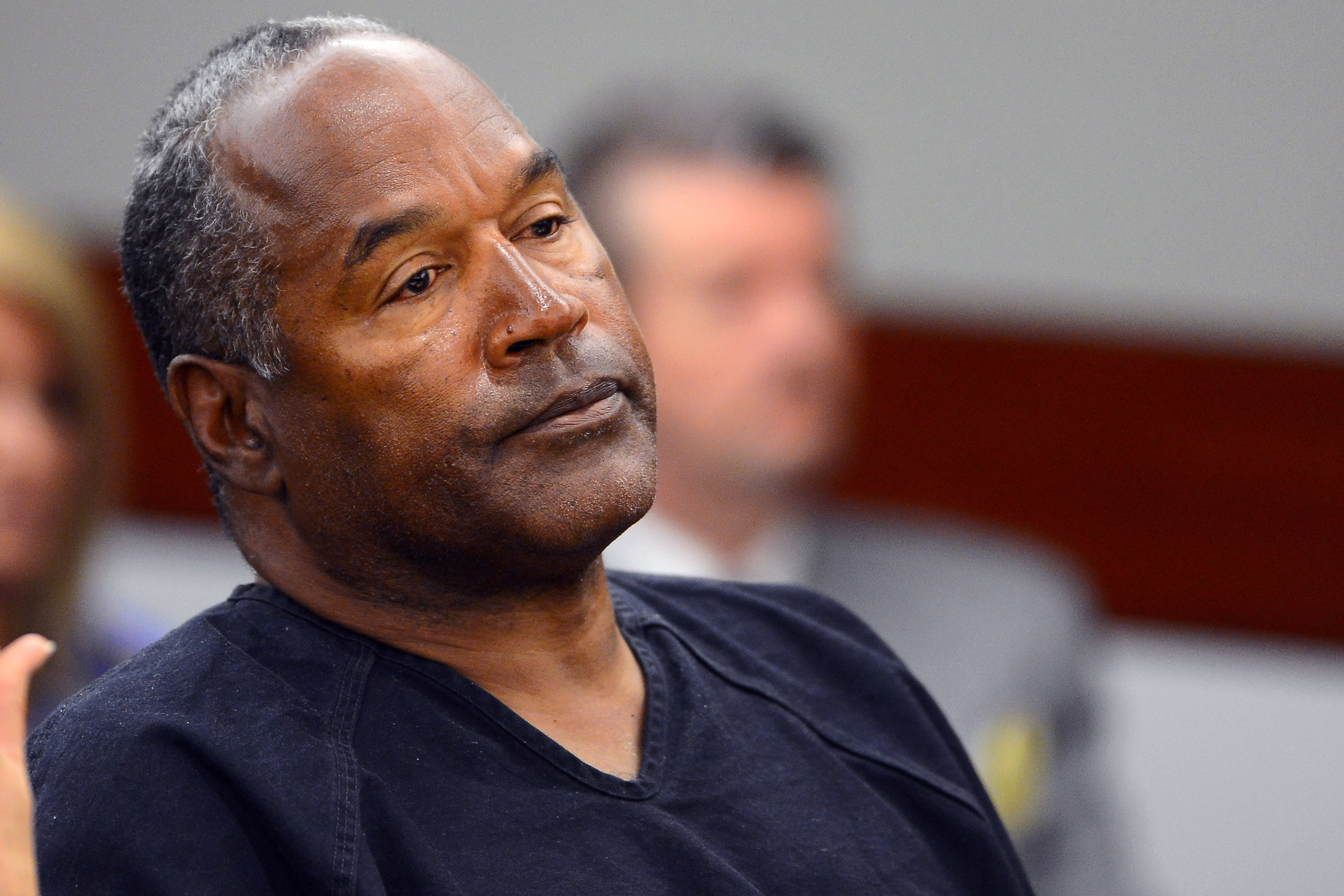 O.J. Simpson watches his former defense attorney Yale Galanter testify during an evidentiary hearing in Clark County District Court in Las Vegas on May 17, 2013.