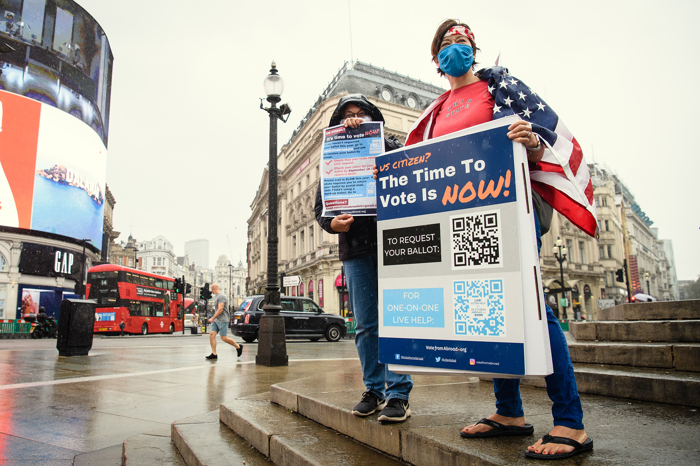 Caryn Jenner (L) and Laura Vogel of "Vote From Abroad" attempt to sign up U.S. citizens in London ahead of the U.S. 2020 presidential election.