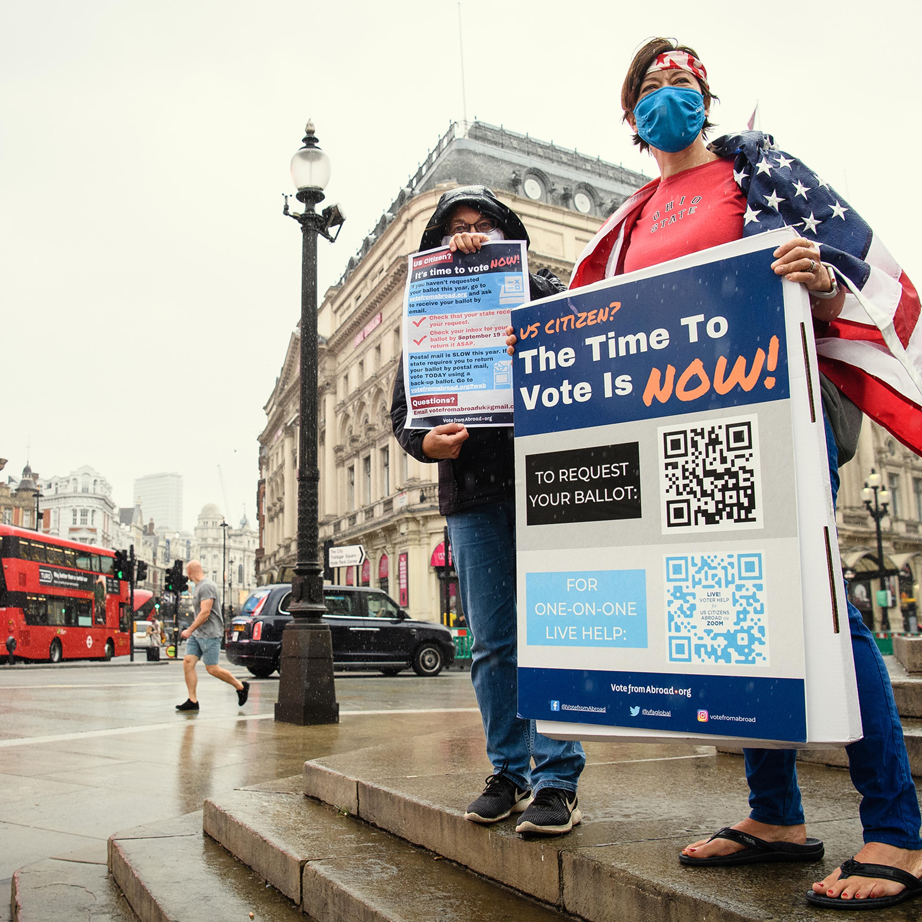 Caryn Jenner (L) and Laura Vogel of "Vote From Abroad" attempt to sign up U.S. citizens in London ahead of the U.S. 2020 presidential election.