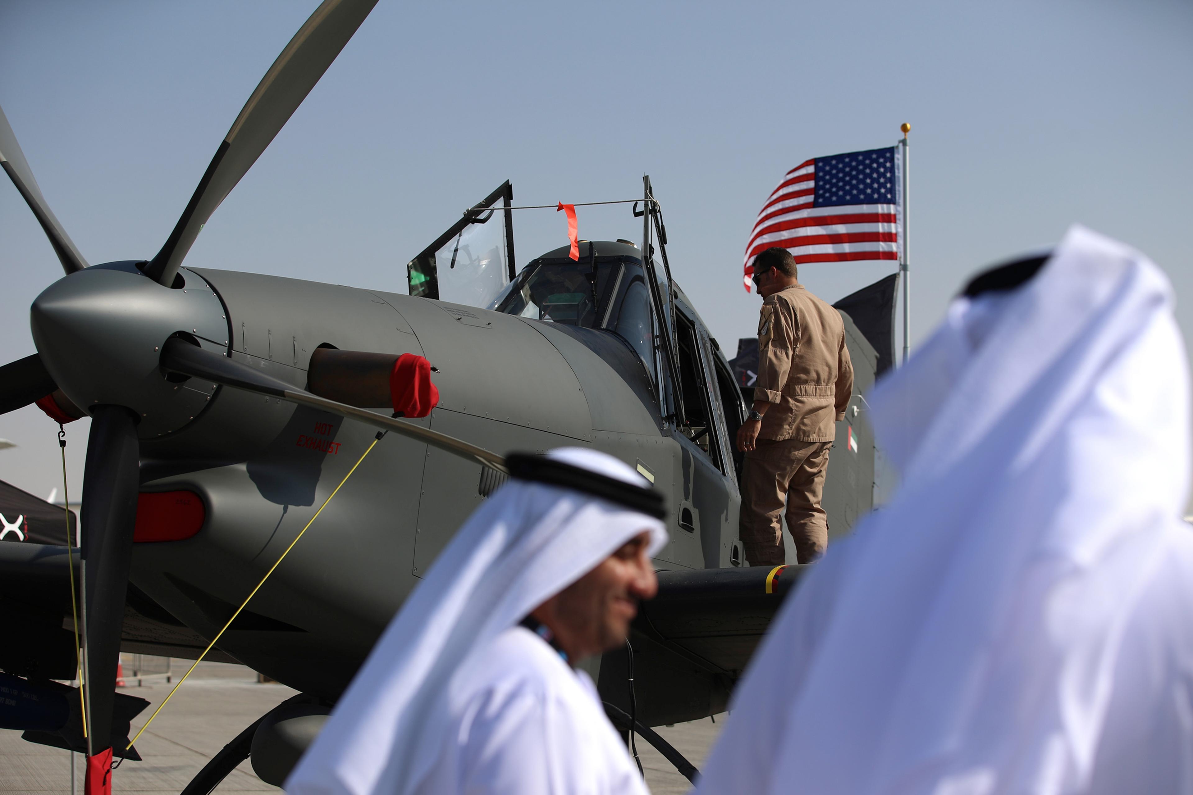 Visitors inspect a Thrush S2R-T660 turboprop border patrol aircraft, outfitted by Archangel, on the opening day of the Dubai Air Show on Nov. 8, 2015.