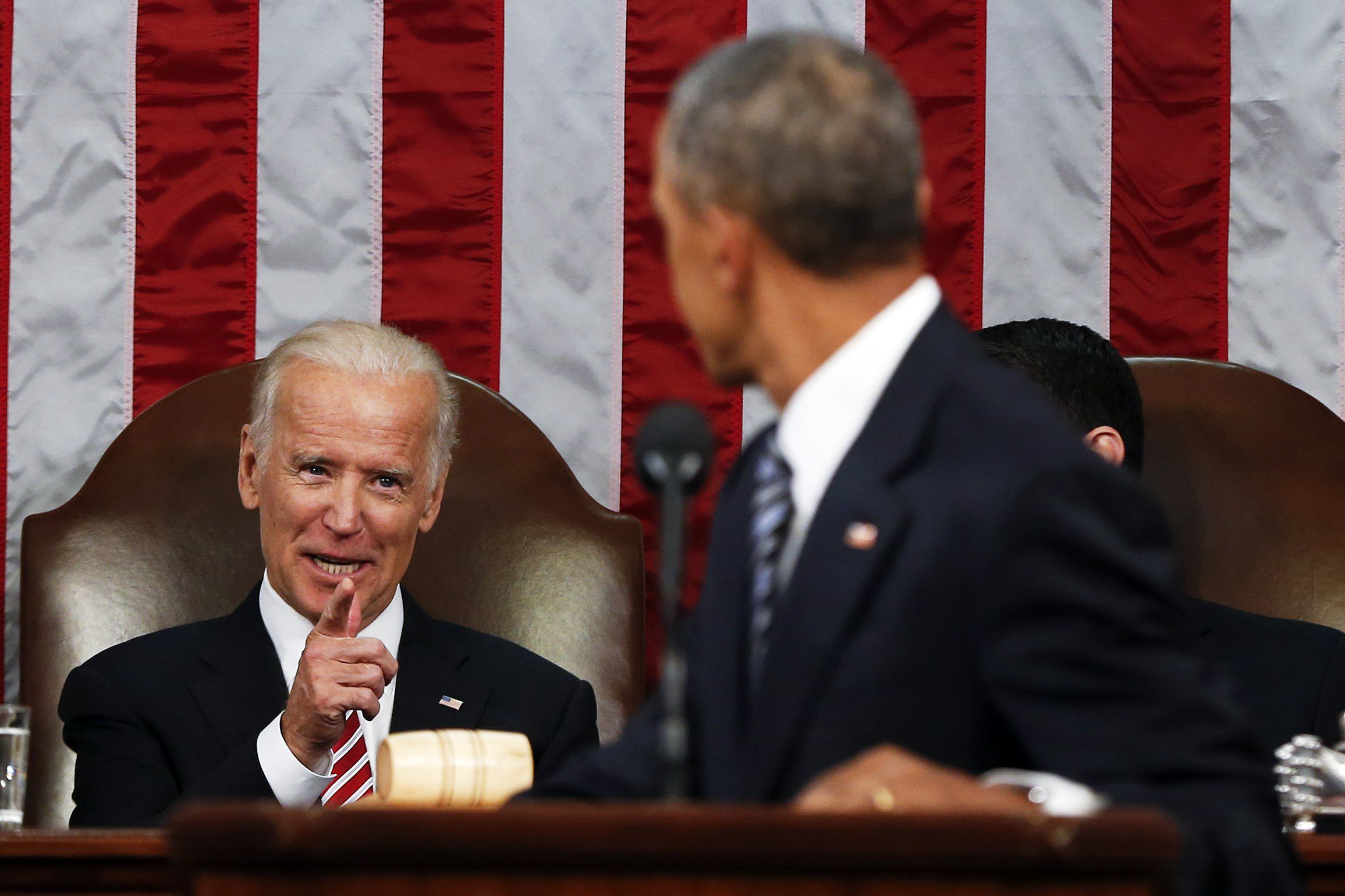 Vice President Joe Biden points at President Barack Obama during the State of the Union address at a joint session of Congress on Capitol Hill in Washington on Tuesday, Jan. 12, 2016.