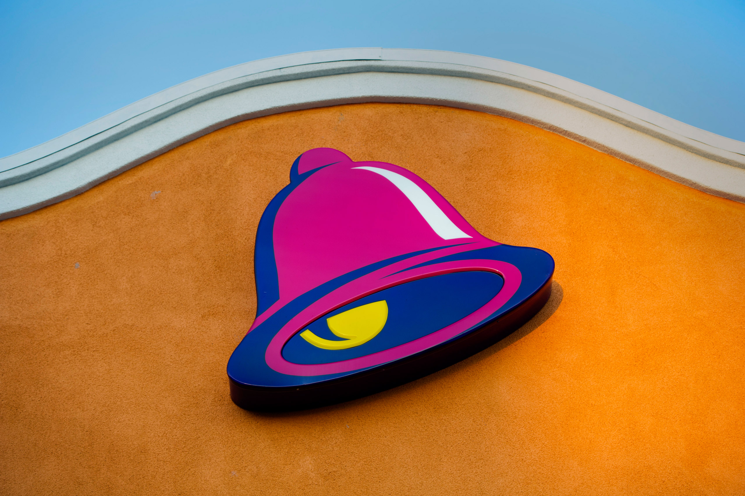 The logo for Taco Bell, a unit of Yum! Brands Inc., is displayed outside of a restaurant in Daly City, California, U.S., on Friday, April 18, 2014. Yum! Brands Inc. is expected to release earnings figures on April 22. Photographer: David Paul Morris/Bloo
