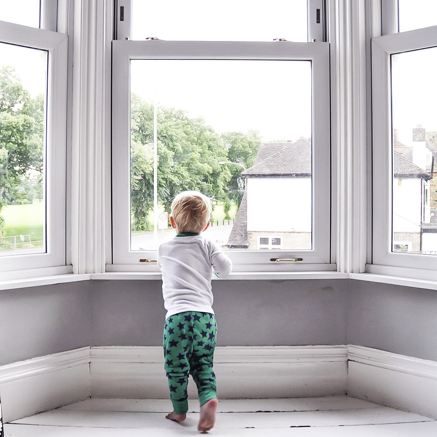 child looking out window