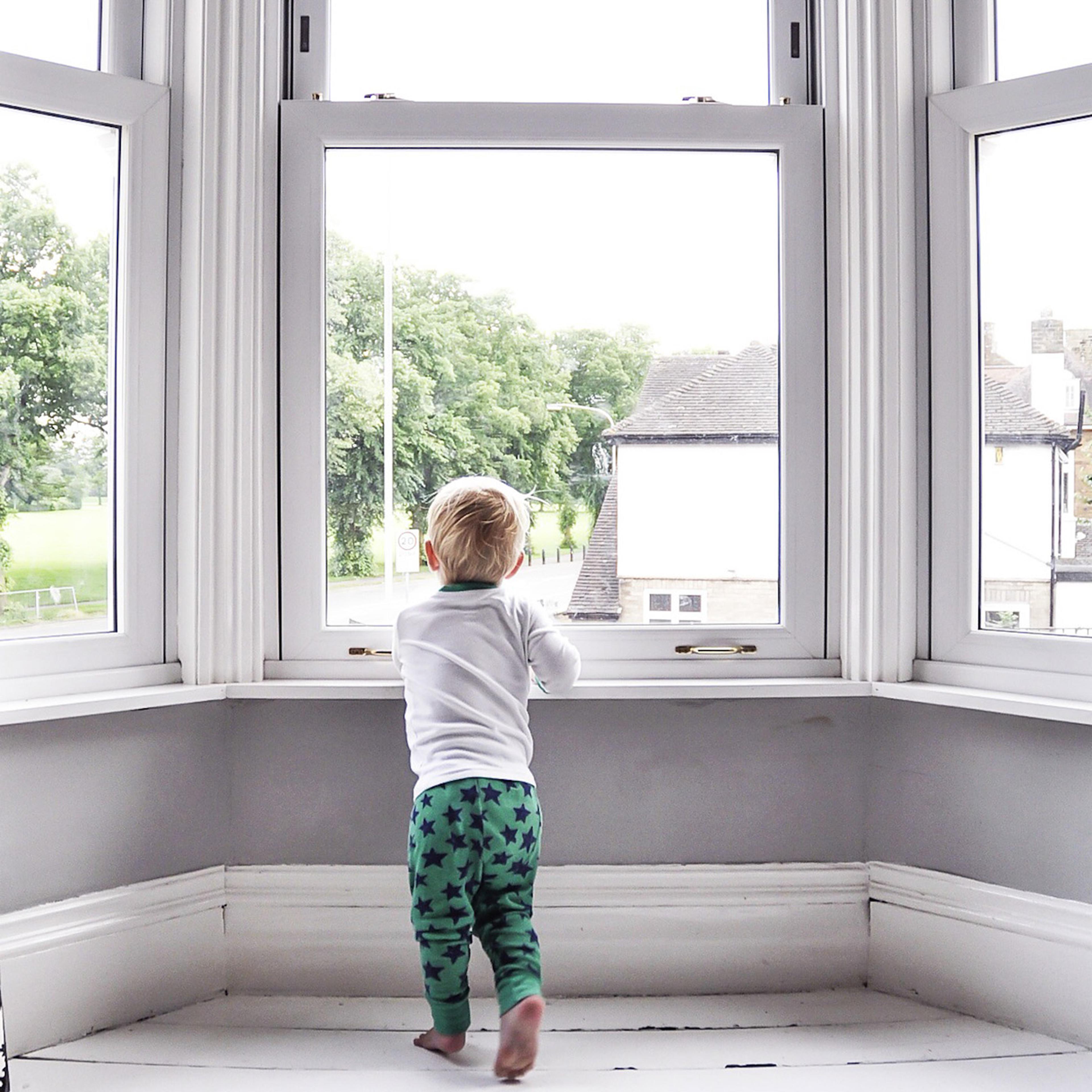 child looking out window