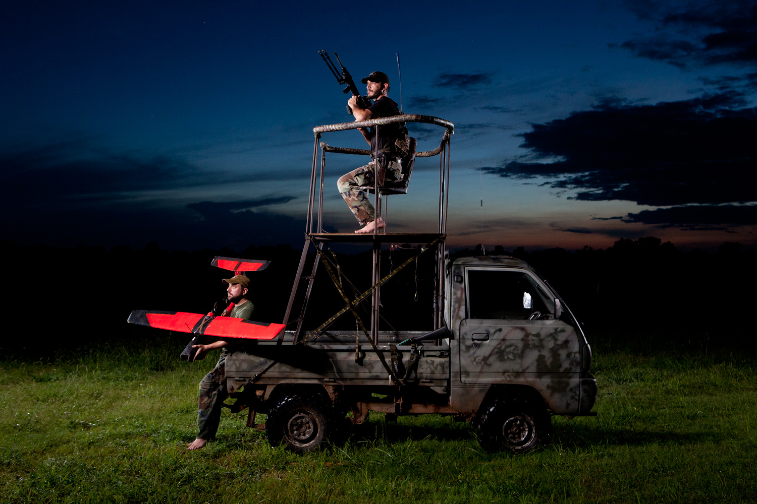 Cy Brown (top) and his hunting partner James Palmer use a homemade drone to hunt wild boar in a rice field. The drone’s name? The “Dehogaflier.”