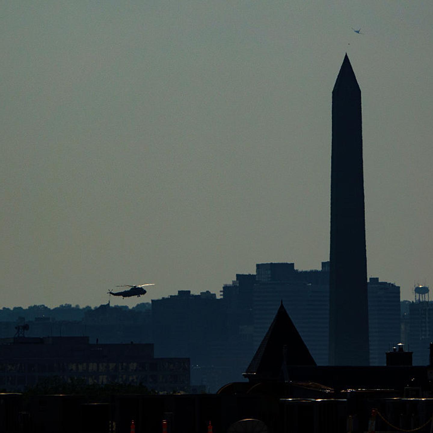 Marine One, carrying U.S. President Donald Trump flies by the Washington Monument while returning to the White House in Washington, D.C., on June 21, 2025.