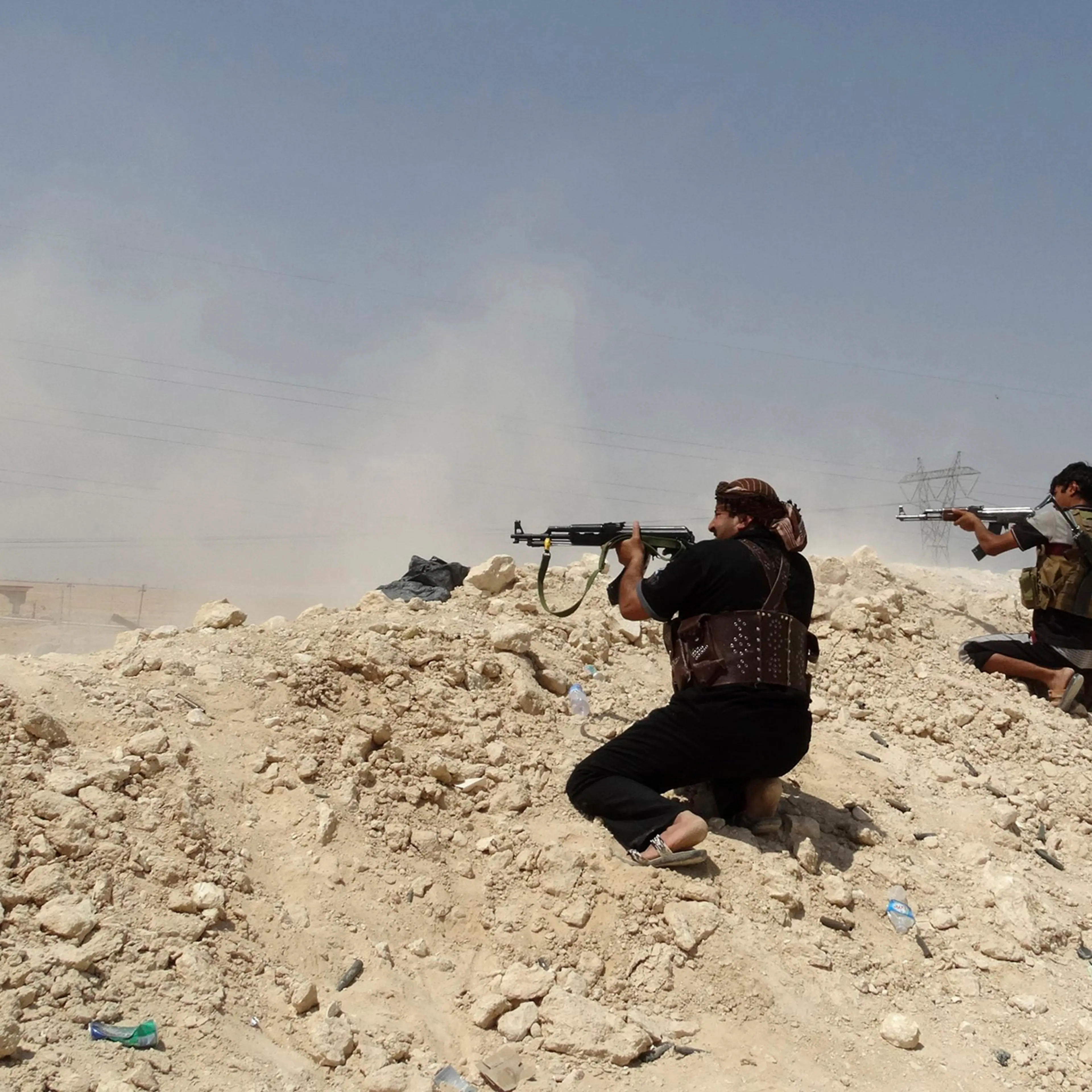 Tribal fighters seen during a battle with ISIS militants, in Haditha, Iraq, Aug. 25, 2014.
