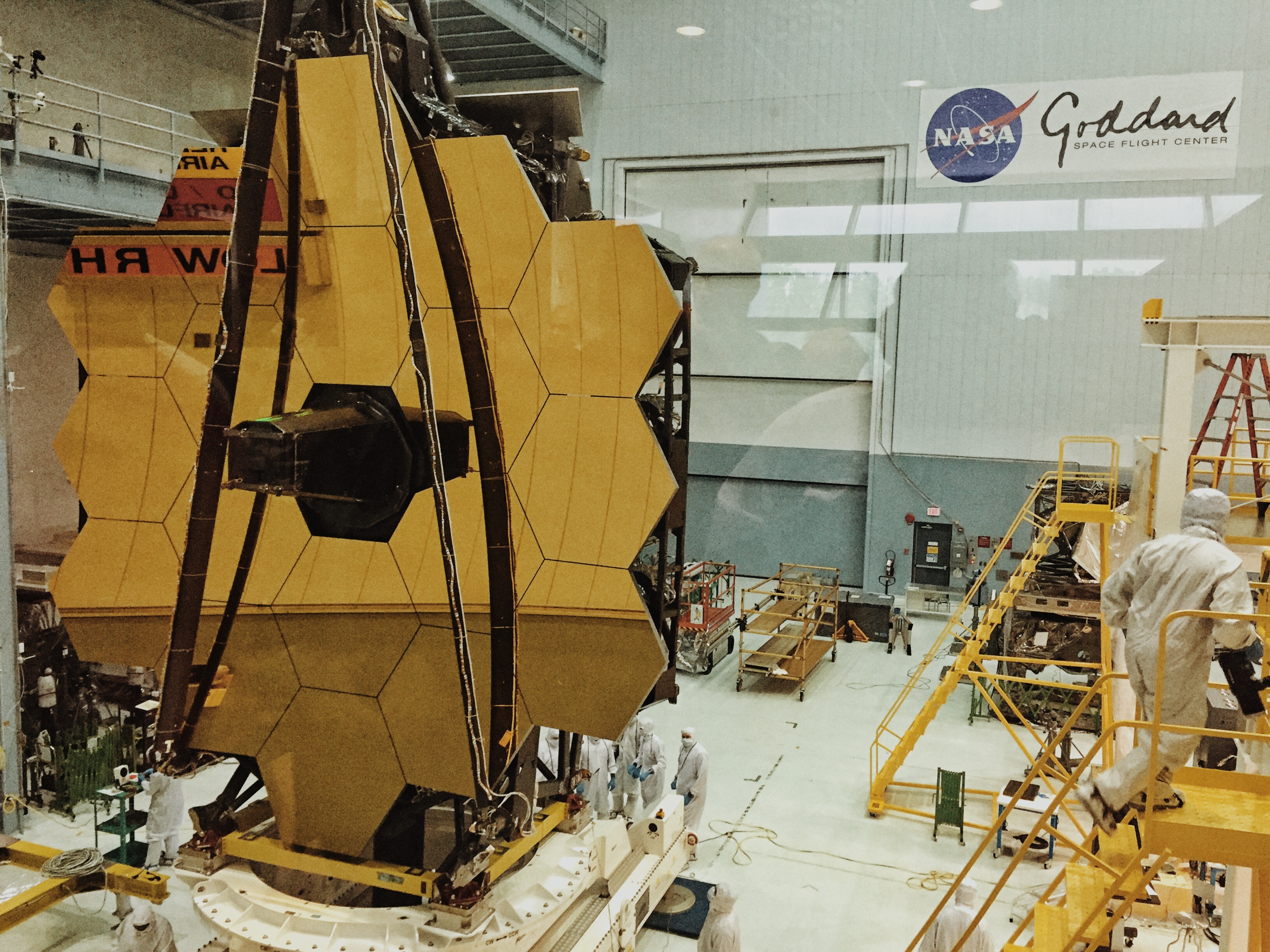 The Webb telescope in its clean room. One of the mirror's 18 segments has been dinged be a micrometeoroid.