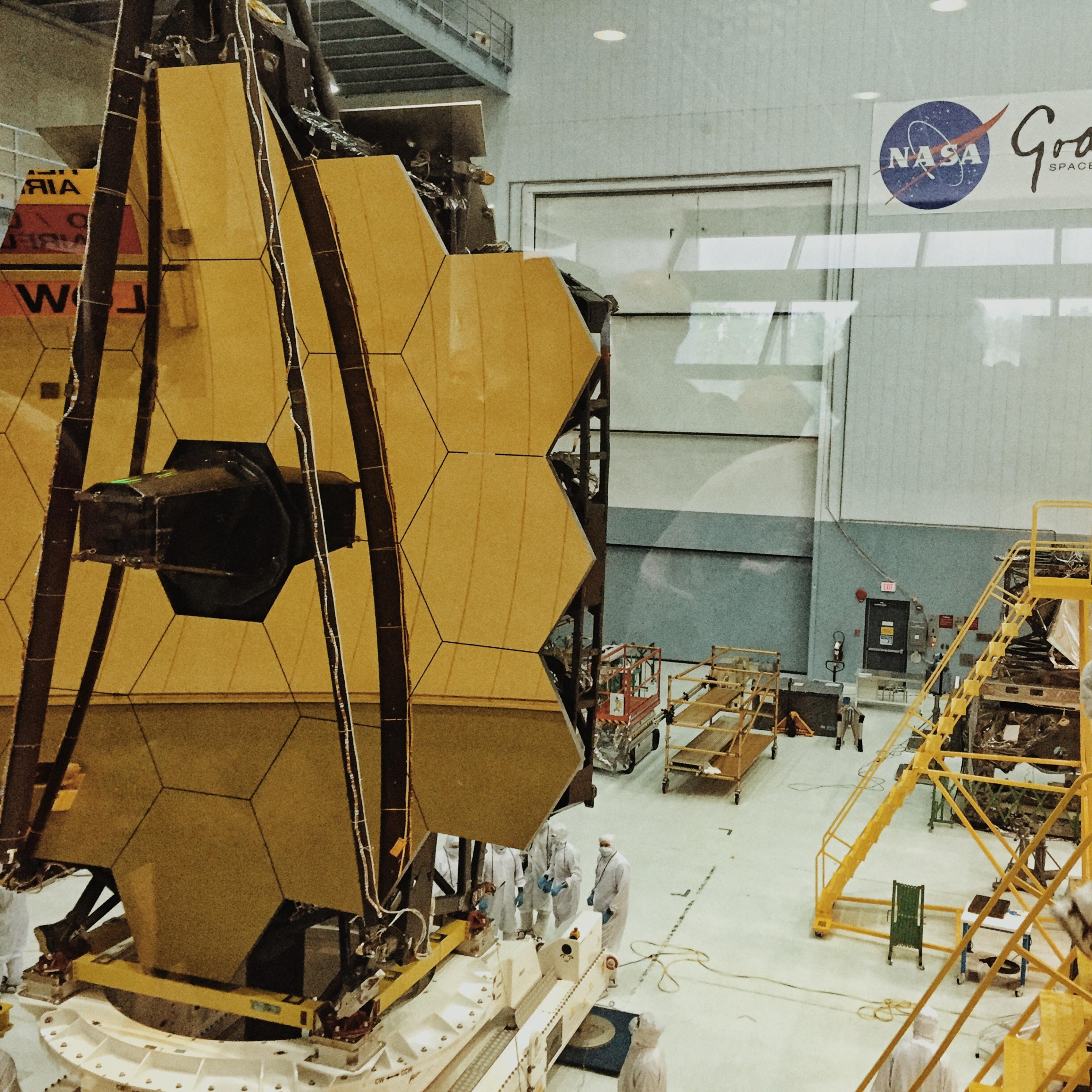 The Webb telescope in its clean room. One of the mirror's 18 segments has been dinged be a micrometeoroid.