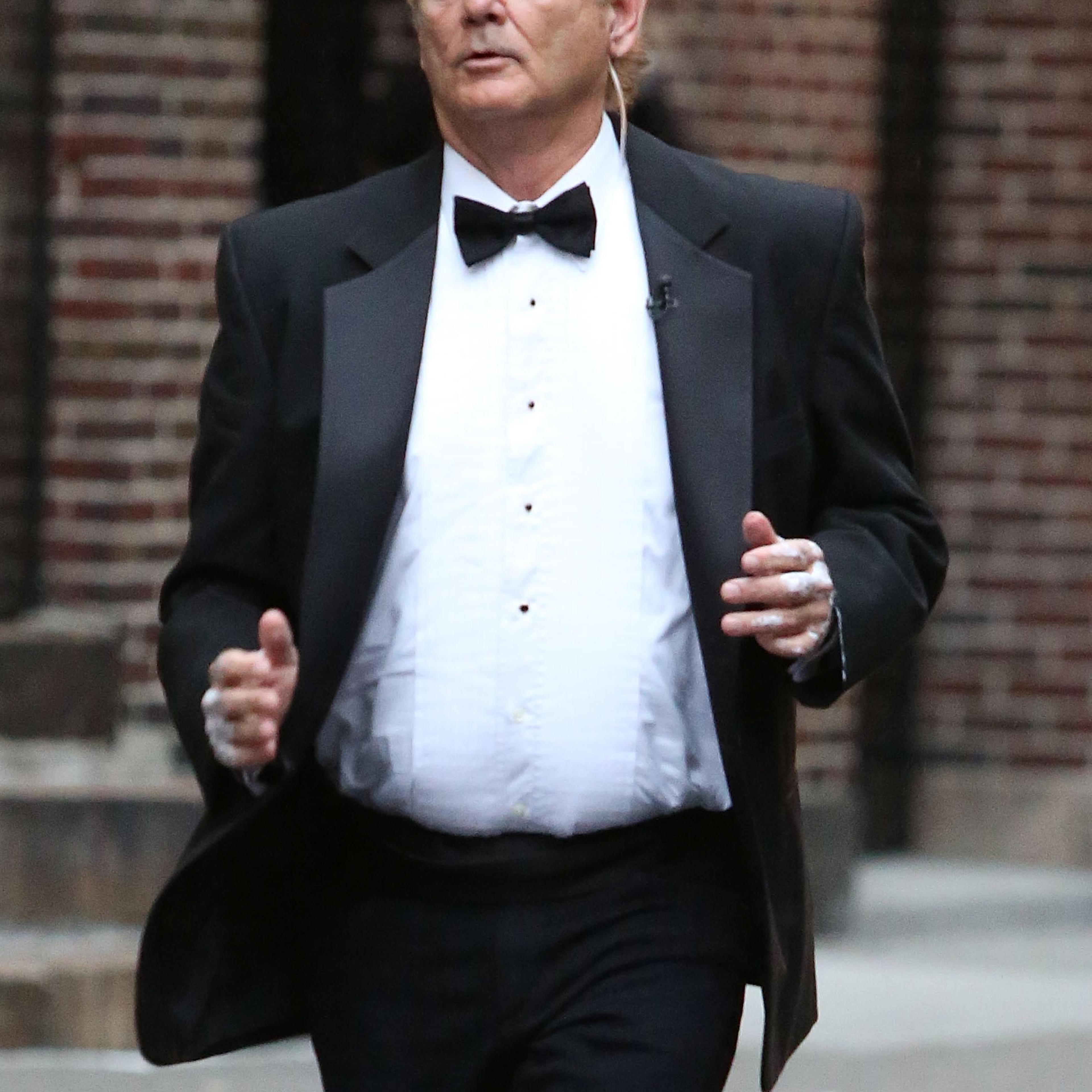 Actor Bill Murray goes jogging in black tie outside of "Late Show with David Letterman" on October 15, 2014 in New York City.